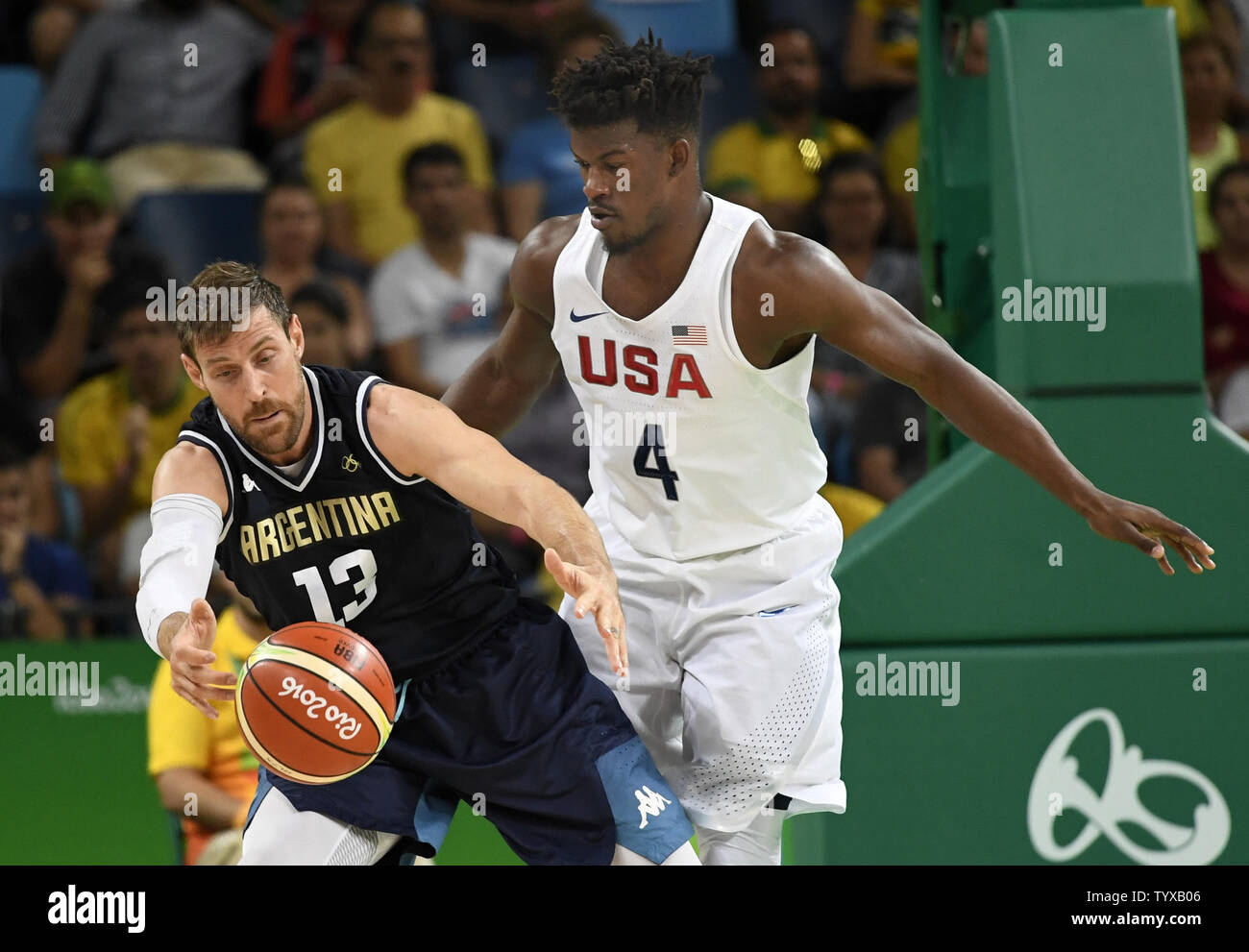 Argentina's Andres Nocioni (L) and United States' Jimmy Butler battle for a  loose ball during the USA vs Argentina Men's Quarterfinal basketball game  at the 2016 Rio Summer Olympics in Rio de