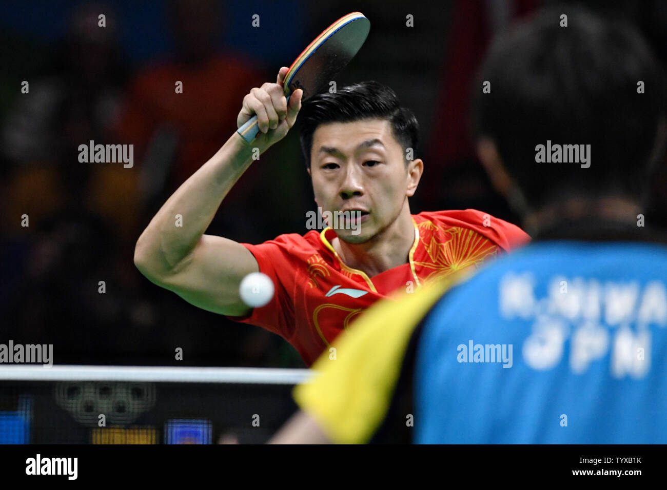 Ma Long of China in action against Koki Niwa of Japan in the Men's Team Table Tennis gold medal match in Riocentro Pavilion 3 at the 2016 Rio Summer Olympics in Rio de Janeiro, Brazil, on August 17, 2016.   Photo by Richard Ellis/UPI Stock Photo