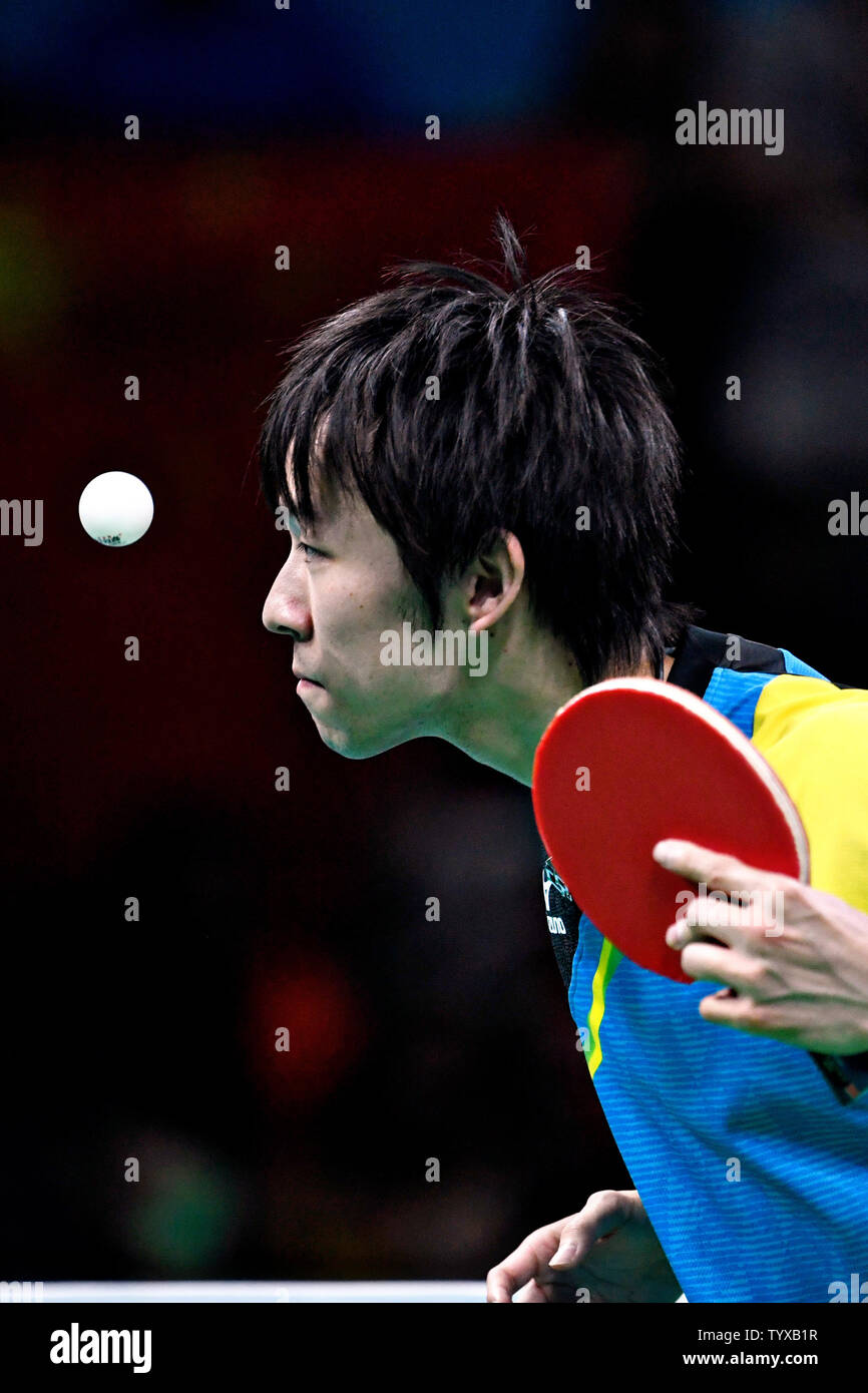 Koki Niwa of Japan in action against Ma Long of China in the Men's Team Table Tennis gold medal match in Riocentro Pavilion 3 at the 2016 Rio Summer Olympics in Rio de Janeiro, Brazil, on August 17, 2016.   Photo by Richard Ellis/UPI Stock Photo
