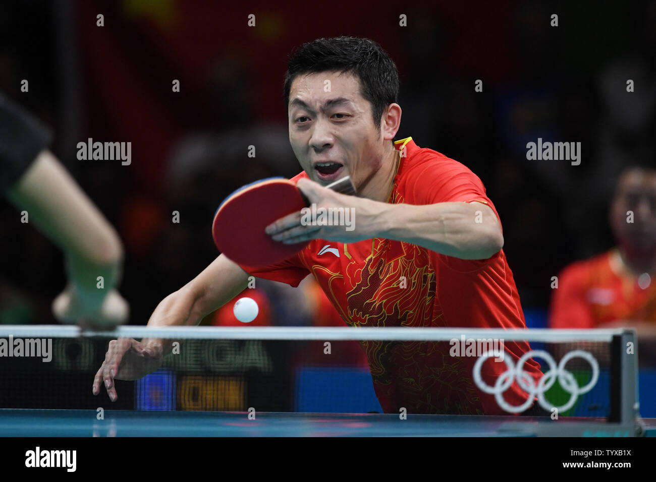 Xu Xin of China during his match against Jun Mizutani of Japan in the Men's Team Table Tennis gold medal match in Riocentro Pavilion 3 at the 2016 Rio Summer Olympics in Rio de Janeiro, Brazil, on August 17, 2016.   Photo by Richard Ellis/UPI Stock Photo
