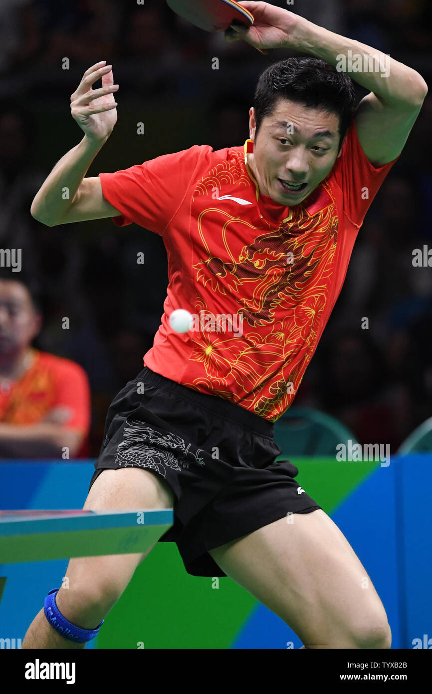 Xu Xin of China during his match against Jun Mizutani of Japan in the Men's Team Table Tennis gold medal match in Riocentro Pavilion 3 at the 2016 Rio Summer Olympics in Rio de Janeiro, Brazil, on August 17, 2016.   Photo by Richard Ellis/UPI Stock Photo