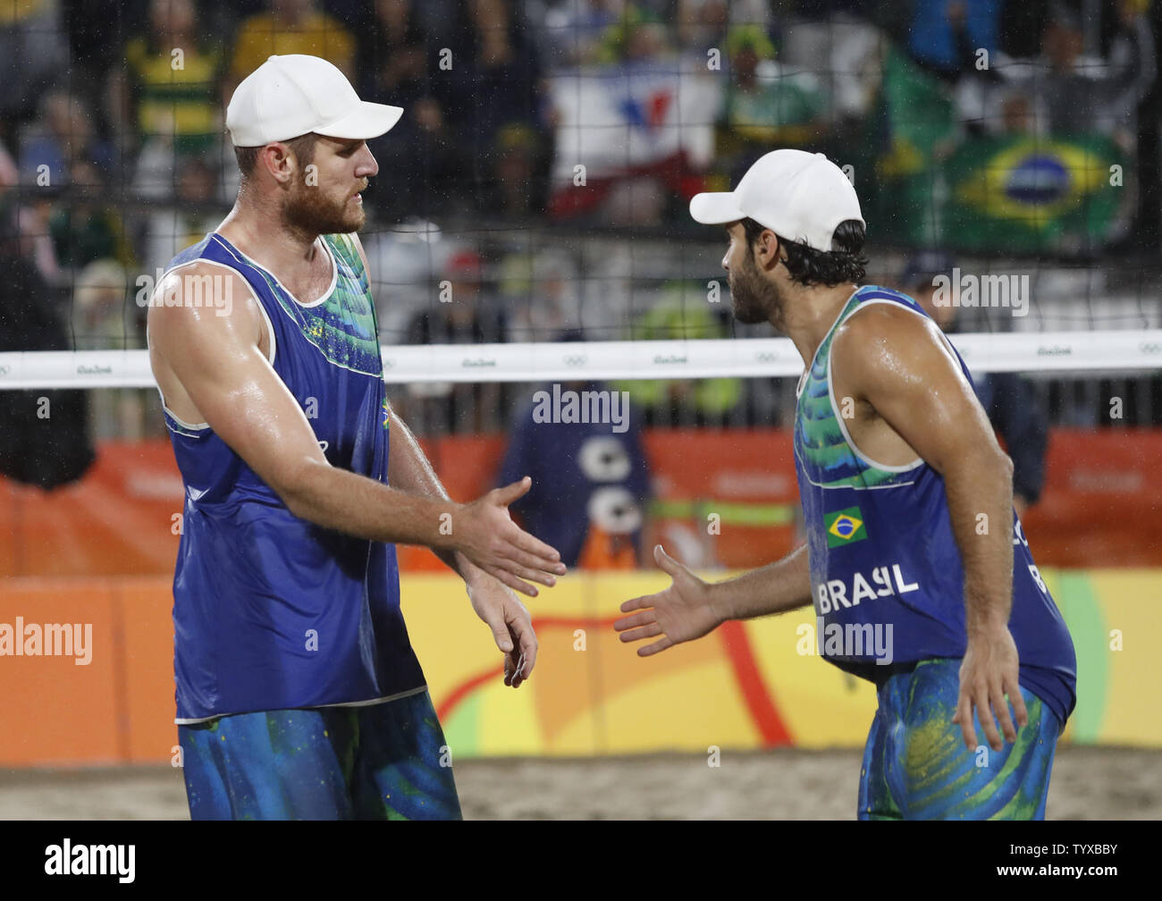 Alison Cerutti and Bruno Schmidt Oscar of Brazil celebrate after a