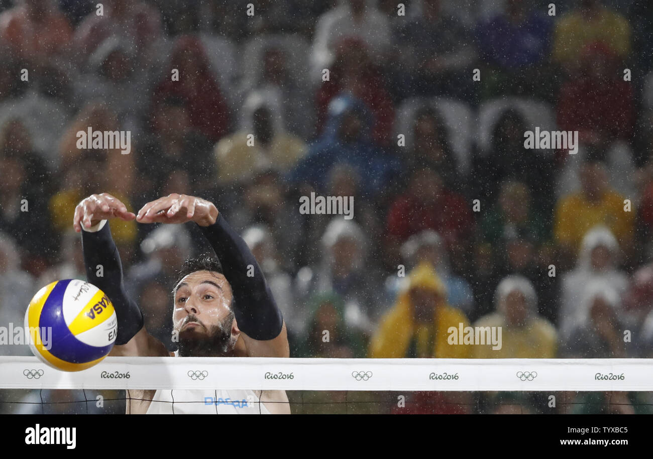 Paolo Nicolai of Italy returns the ball over the net in the Men's Beach