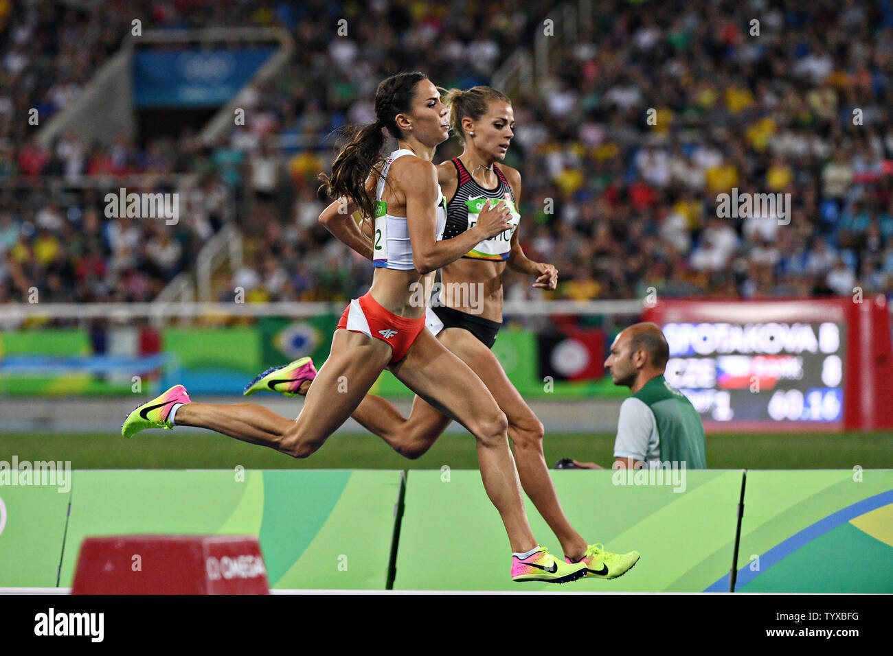 Joanna Jozwik of Poland passes Canada Melissa Bishop competing in the Women's 800m Semifinal 2 at the 2016 Rio Summer Olympics in Rio de Janeiro, Brazil, on August 18, 2016.   Photo by Richard Ellis/UPI Stock Photo
