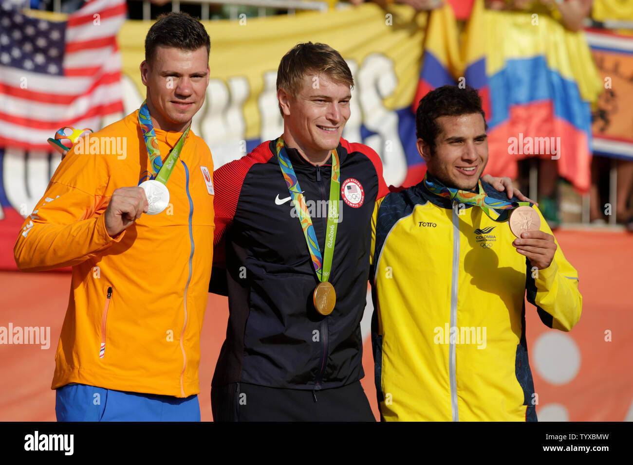 Medalists in Men's Cycling (L-R) Netherland's Jelle von with silver, Connor Fields with gold and Columbia's Carlos Alberto Ramirez Yepes with bronze pose for a photo in the Olympic