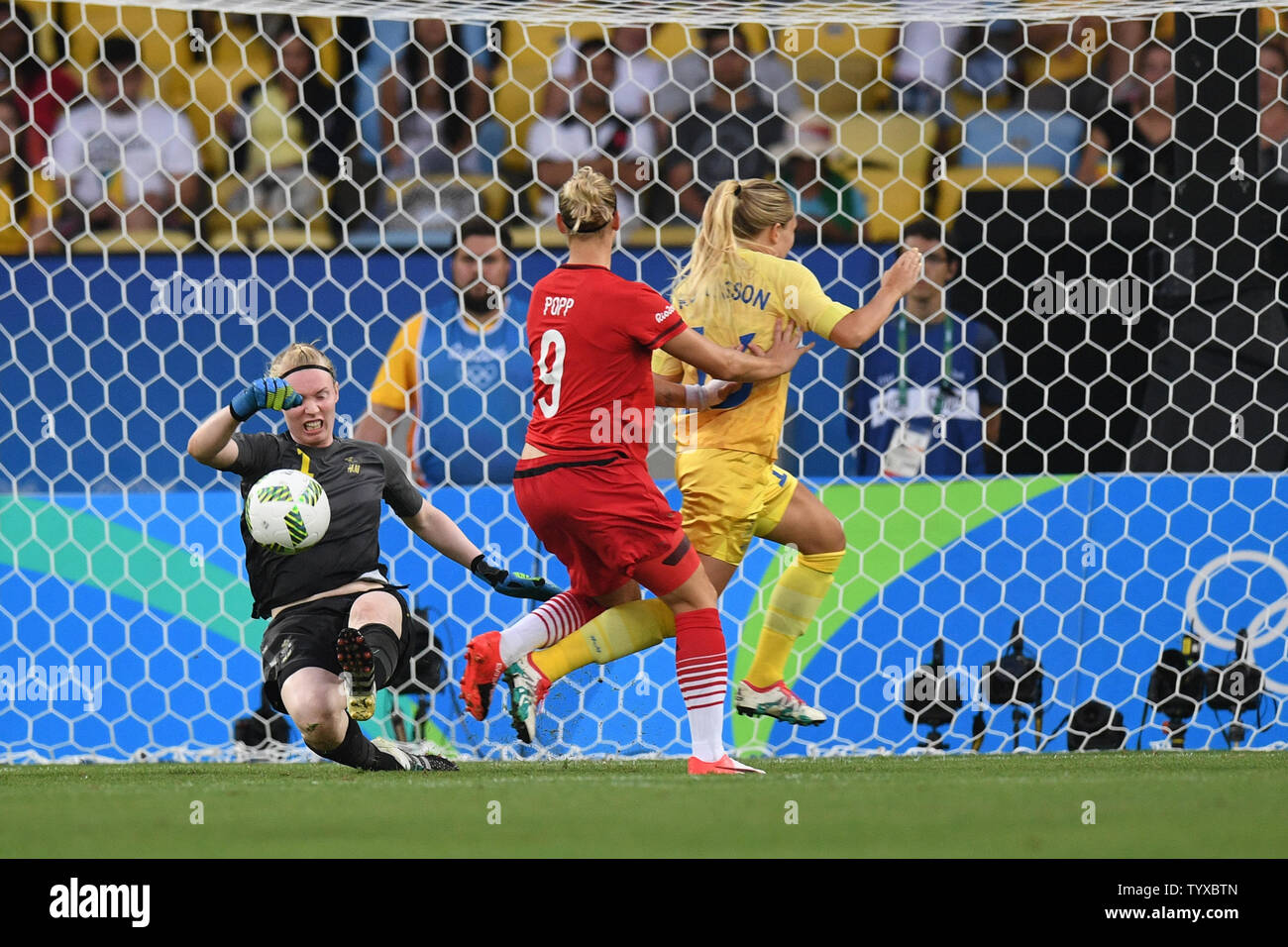 Swedish goal keeper Hedvig Lindahl (1) blocks a shot by Alexandra Popp (9) of Germany during early action against Germany during the Women's Football gold medal match in the Maracana Stadium at the 2016 Rio Summer Olympics in Rio de Janeiro, Brazil, on August 19, 2016. Germany won the gold medal 2-1 and Sweden the silver.          Photo by Richard Ellis/UPI Stock Photo