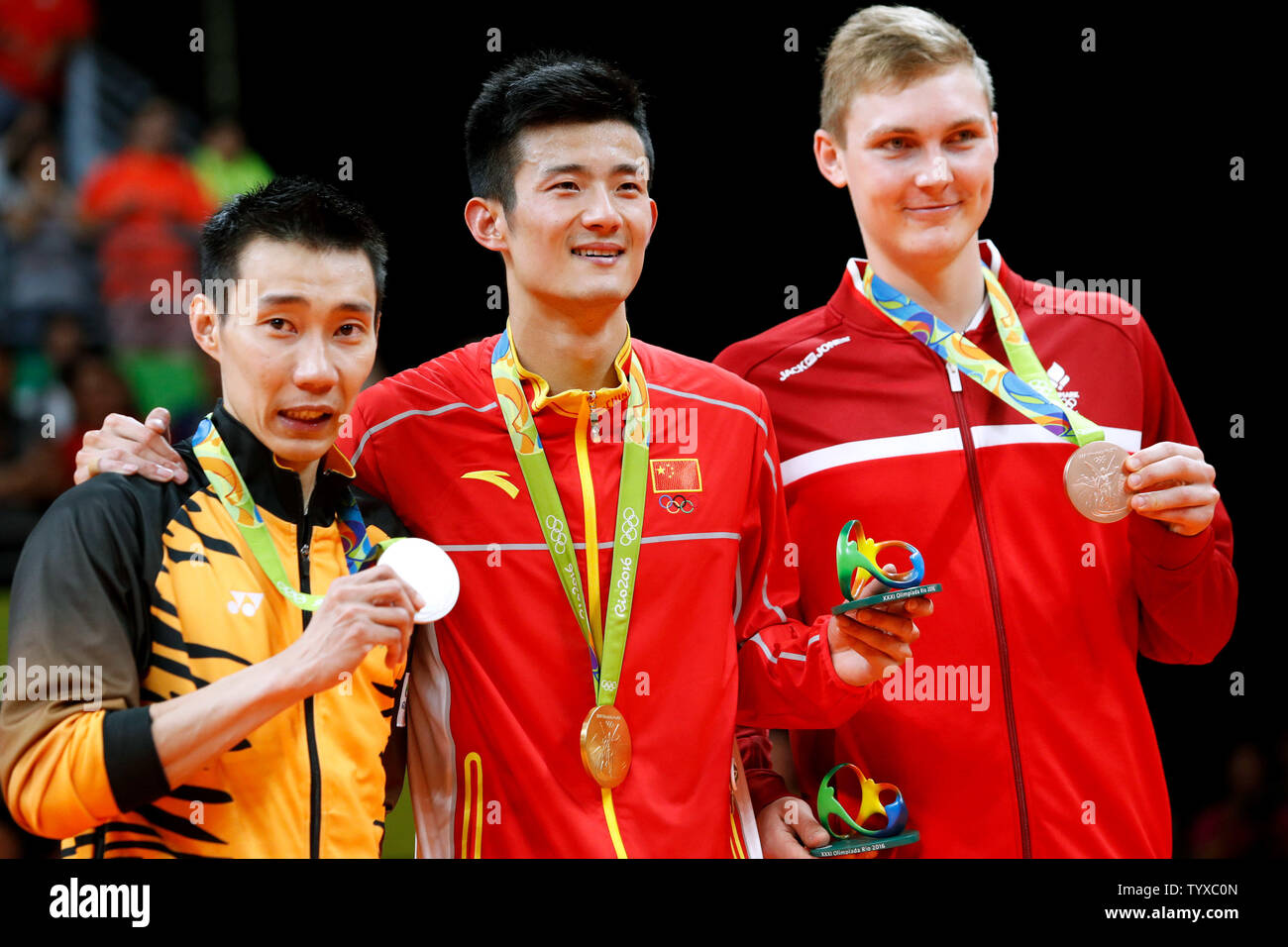 Medalists in Men's Badminton Singles (L-R) Malaysia's Chong Wei Lee with silver, China's Long Chen with gold and Denmark's Viktor Axelsen with bronze, pose for a photo with their medals at the 2016 Rio Summer Olympics in Rio de Janeiro, Brazil, on August 20, 2016.   Photo by Matthew Healey/UPI Stock Photo