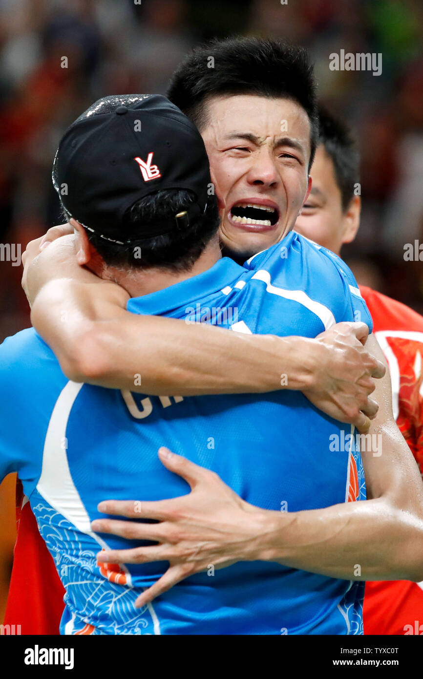 China's Long Chen is given a hug by his coach after defeating Malaysia ...