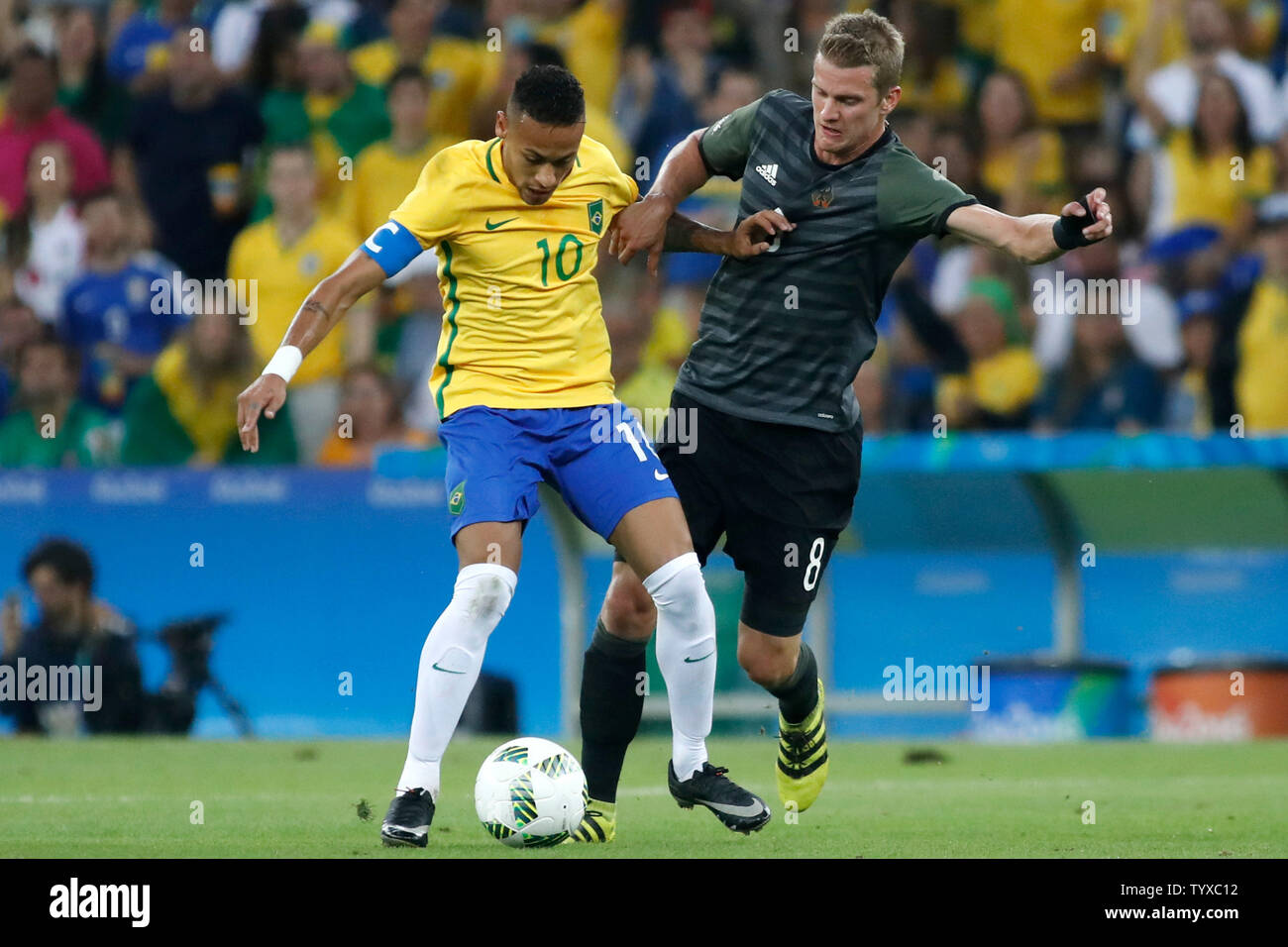 Brazil forward Neymar (10) and German midfielder Lars Bender (8) battle for a ball in the first half of the Men's Gold Medal soccer match at the 2016 Rio Summer Olympics in Rio de Janeiro, Brazil, on August 20, 2016.    Photo by Matthew Healey/UPI Stock Photo