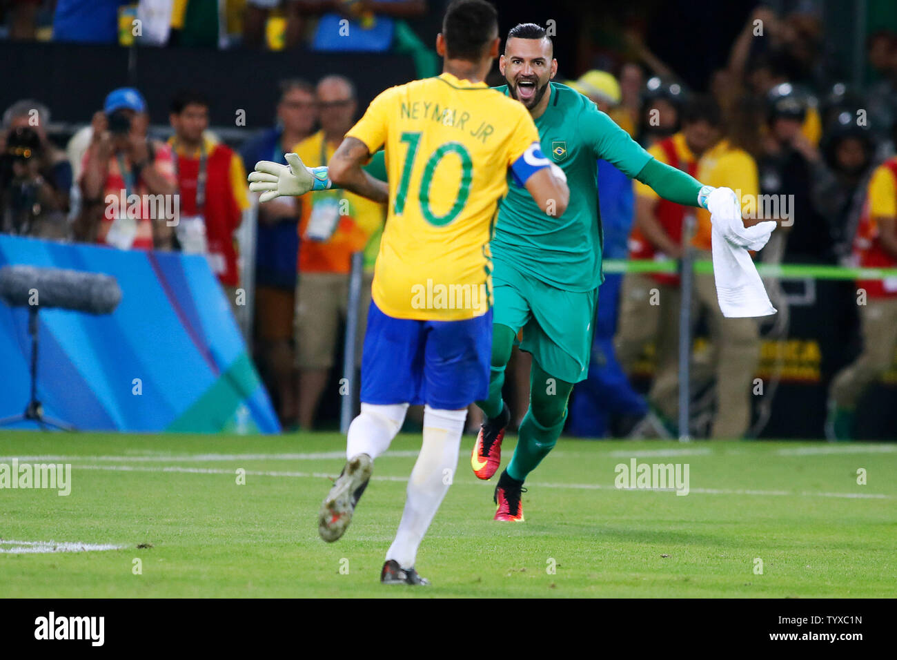 Brazil forward Neymar (10) charges towards goaltender Waverton (1) after Neymar scored the game winning goal in an overtime shoot-out against Germany in the Men's Gold Medal soccer match at the 2016 Rio Summer Olympics in Rio de Janeiro, Brazil, on August 20, 2016. Brazil defeated Germany in 5-4 in overtime penalty kicks.   Photo by Matthew Healey/UPI Stock Photo