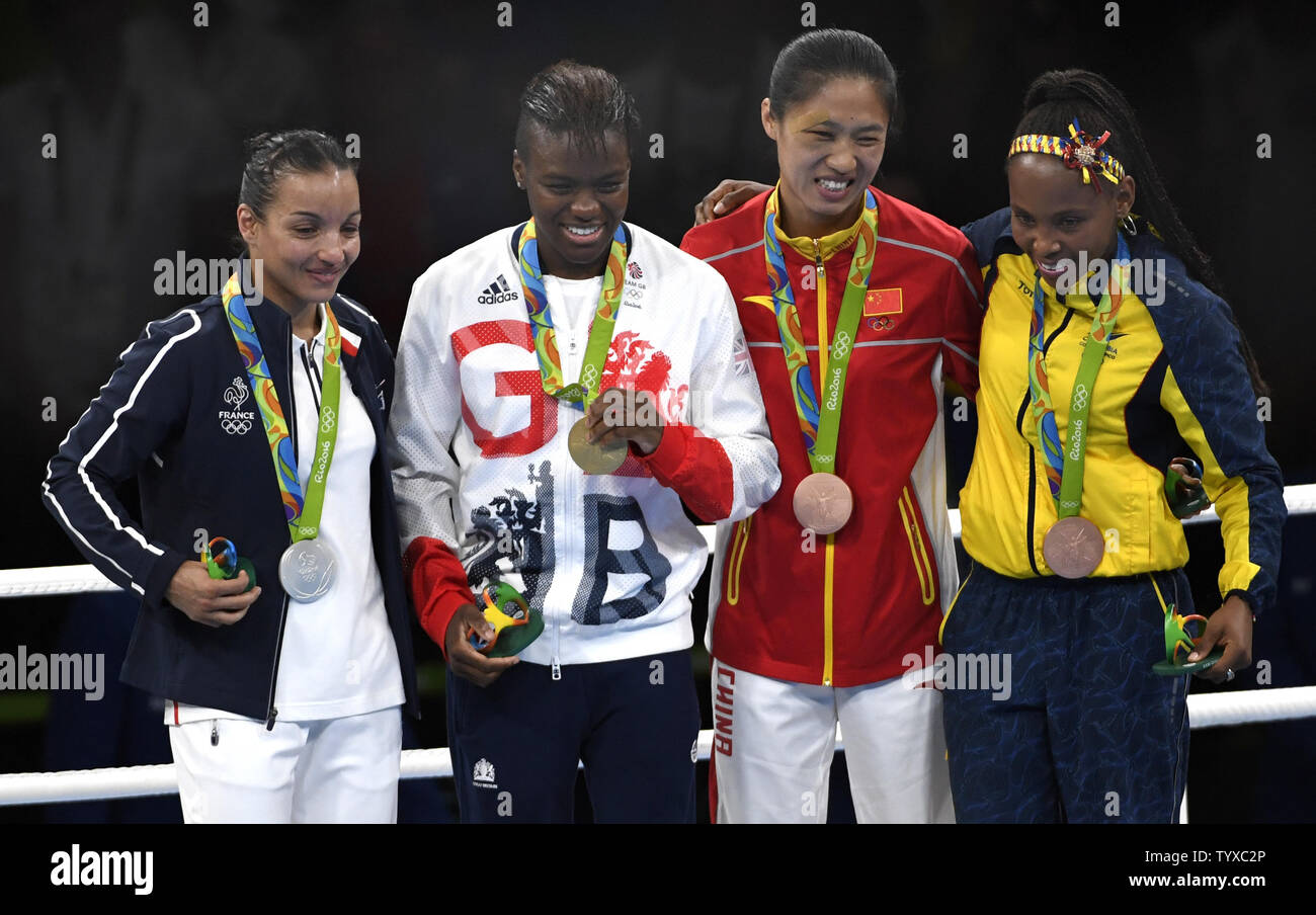 Medal Winners L R France S Sarah Ourahmoune Silver Great Britain S Nicola Adams Gold And Bronze Medal Winners China S Cancan Ren And Colombia S Victoria Valencia Show Off Their Medals For The Women S Flyweight Category