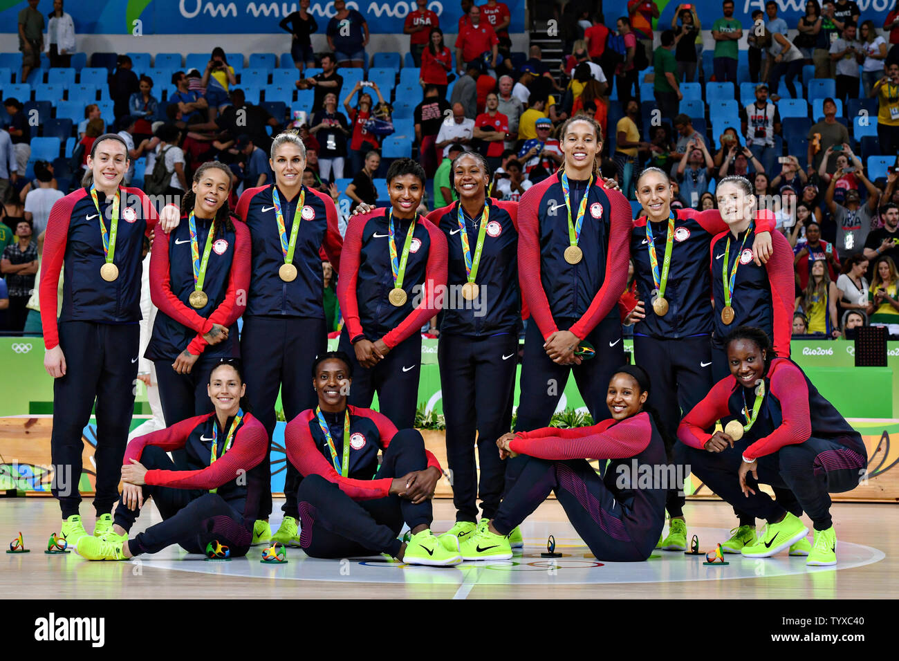 Members of the United States Women's Basketball team pose with their gold  medals after winning the Women's Basketball gold medal game in the Carioca  Arena 1 at the 2016 Rio Summer Olympics