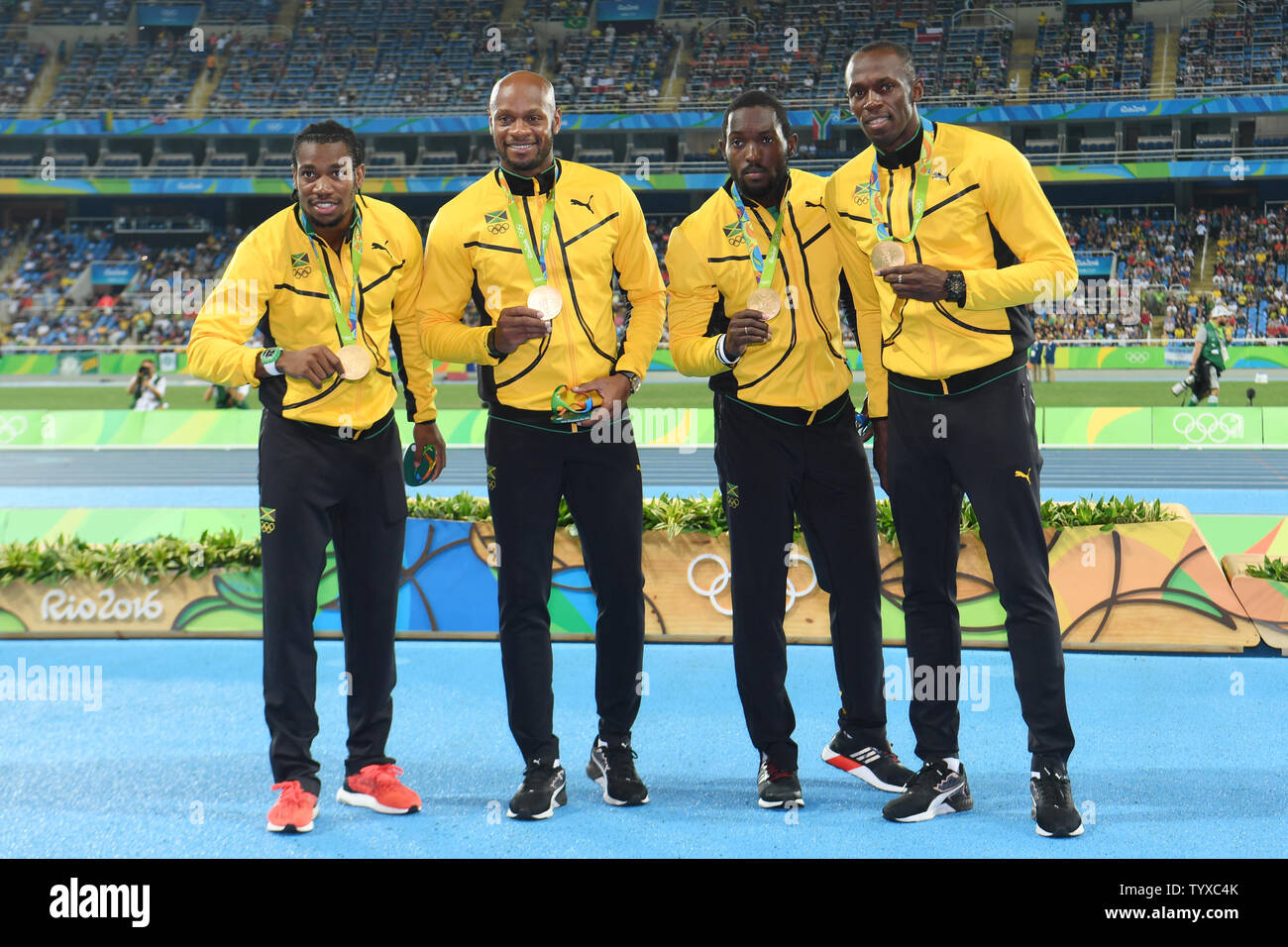 The Jamaica men's 4x100m relay team poses with their gold medals during the award ceremony at the 2016 Rio Summer Olympics in Rio de Janeiro, Brazil, on August 20, 2016. (L-R)   Photo by Richard Ellis/UPI Stock Photo