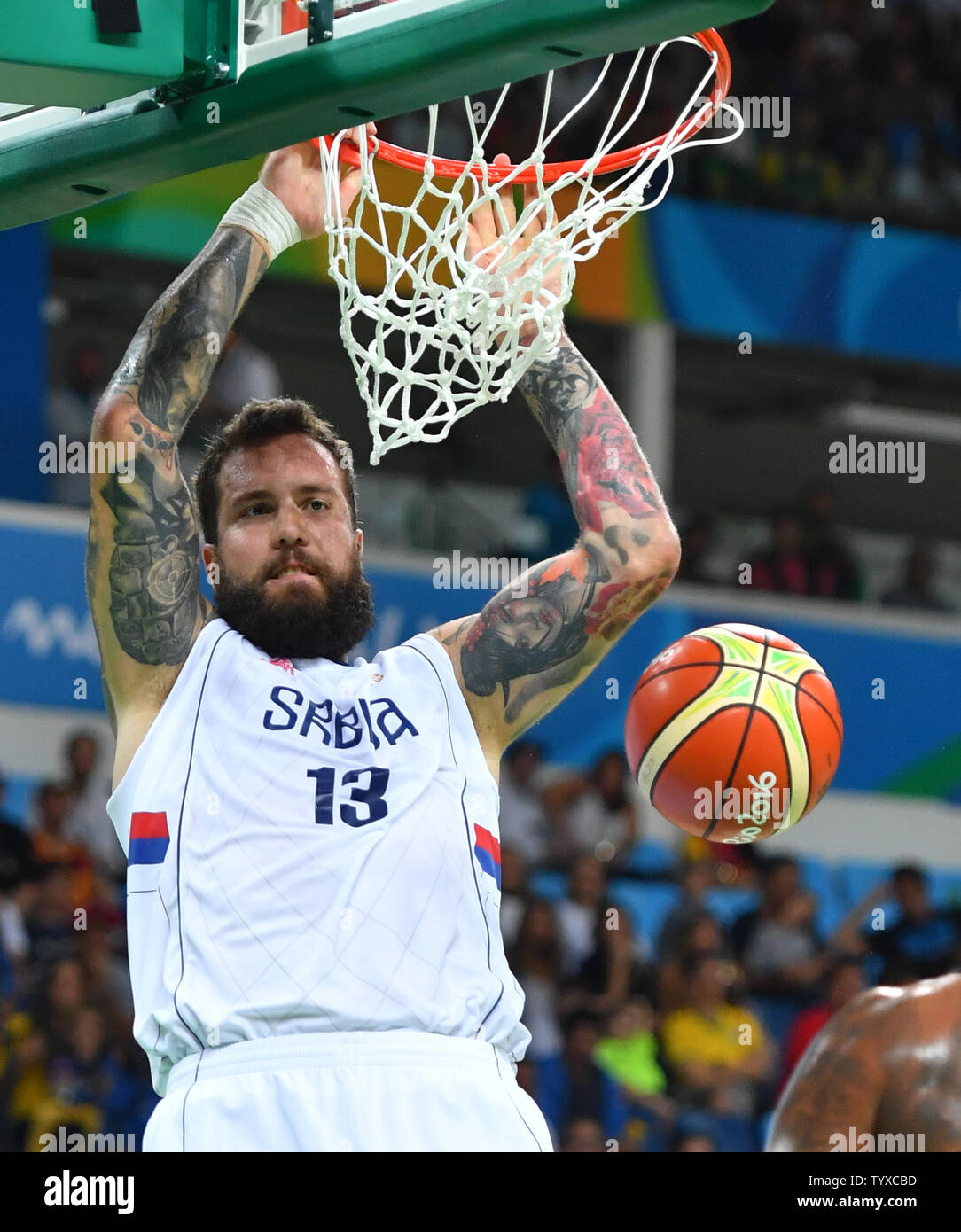 Miroslav Raduljica of Serbia dunks the basketball in the Men's Basketball  gold medal game between Serbia and the United States at Carioca Arena 1 at  the 2016 Rio Summer Olympics in Rio