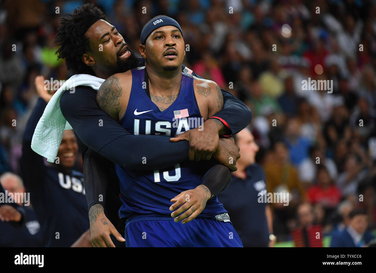 DeAndre Jordan hugs Carmelo Anthony of the United States after Kevin Durant makes a 3-point shot in the first half against Serbia in the Men's Basketball gold medal game between Serbia and the United States at Carioca Arena 1 at the 2016 Rio Summer Olympics in Rio de Janeiro, Brazil, on August 21, 2016.   Photo by Kevin Dietsch/UPI Stock Photo