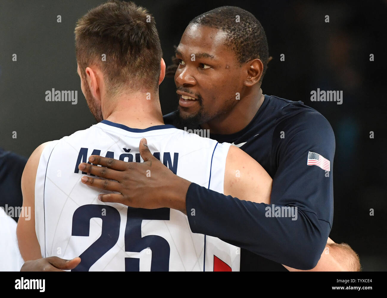 Kevin Durant  of the United States hugs Milan Macvan of Serbia after the Men's Basketball gold medal game between Serbia and the United States at Carioca Arena 1 at the 2016 Rio Summer Olympics in Rio de Janeiro, Brazil, on August 21, 2016. The United States defeated Serbia 96-66 to win its third consecutive gold medal.  Photo by Kevin Dietsch/UPI Stock Photo