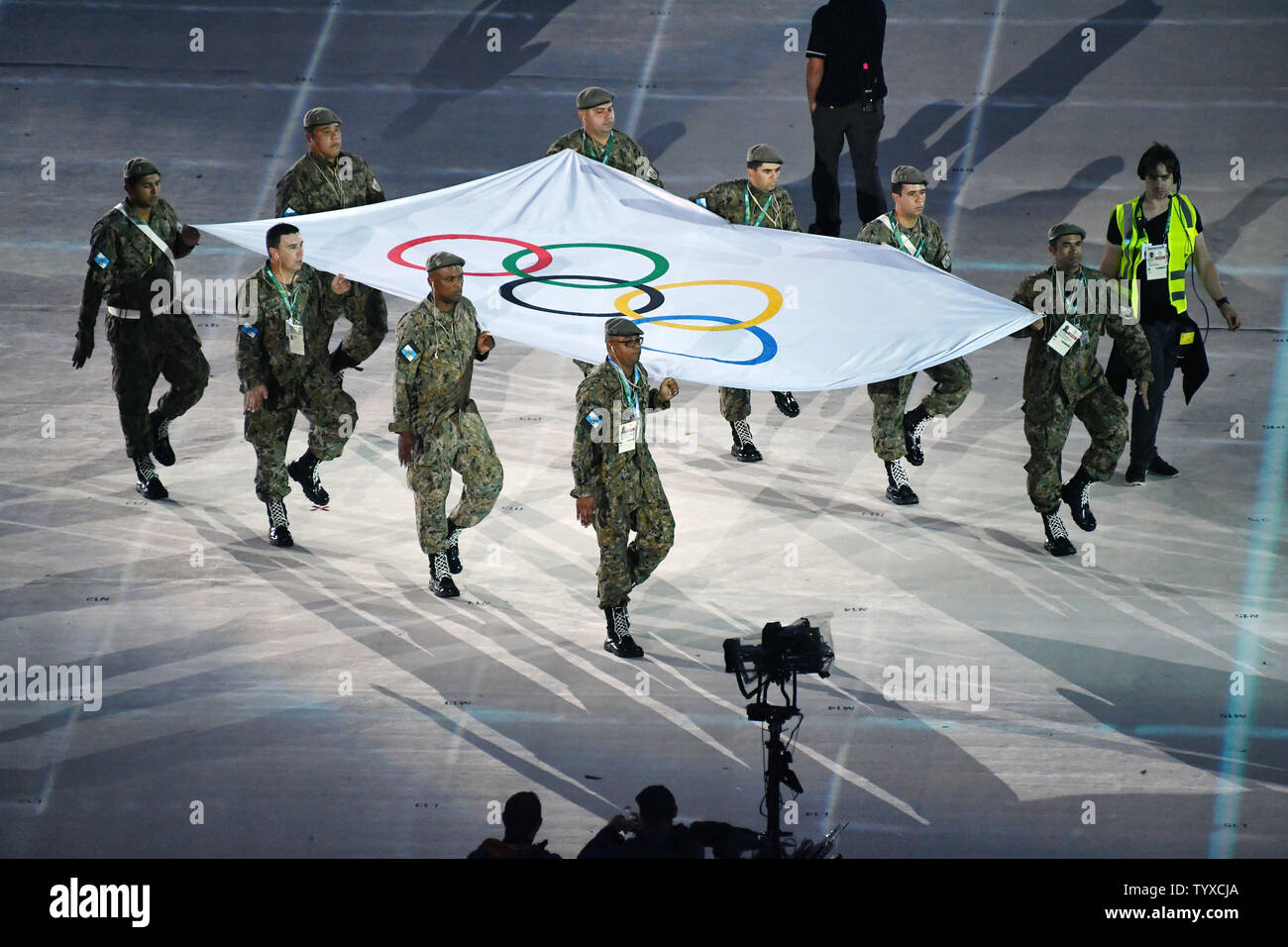 Soldiers stand in carrying the Olympic Flag during rehearsal before the Closing Ceremony in Maracan‹ Stadium at the 2016 Rio Summer Olympics in Rio de Janeiro, Brazil, on August 21, 2016.      Photo by Richard Ellis/UPI Stock Photo