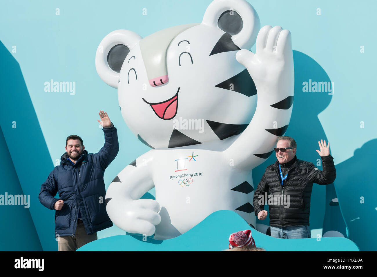 Tourists pose for a photo with the official mascot Soohorang the white tiger prior to the start of the in 2018 Pyeongchang Winter Olympics at the Gangneung Coastal Cluster in Gangneung, South Korea on February 8, 2018. photo by Richard Ellis/UPI Stock Photo