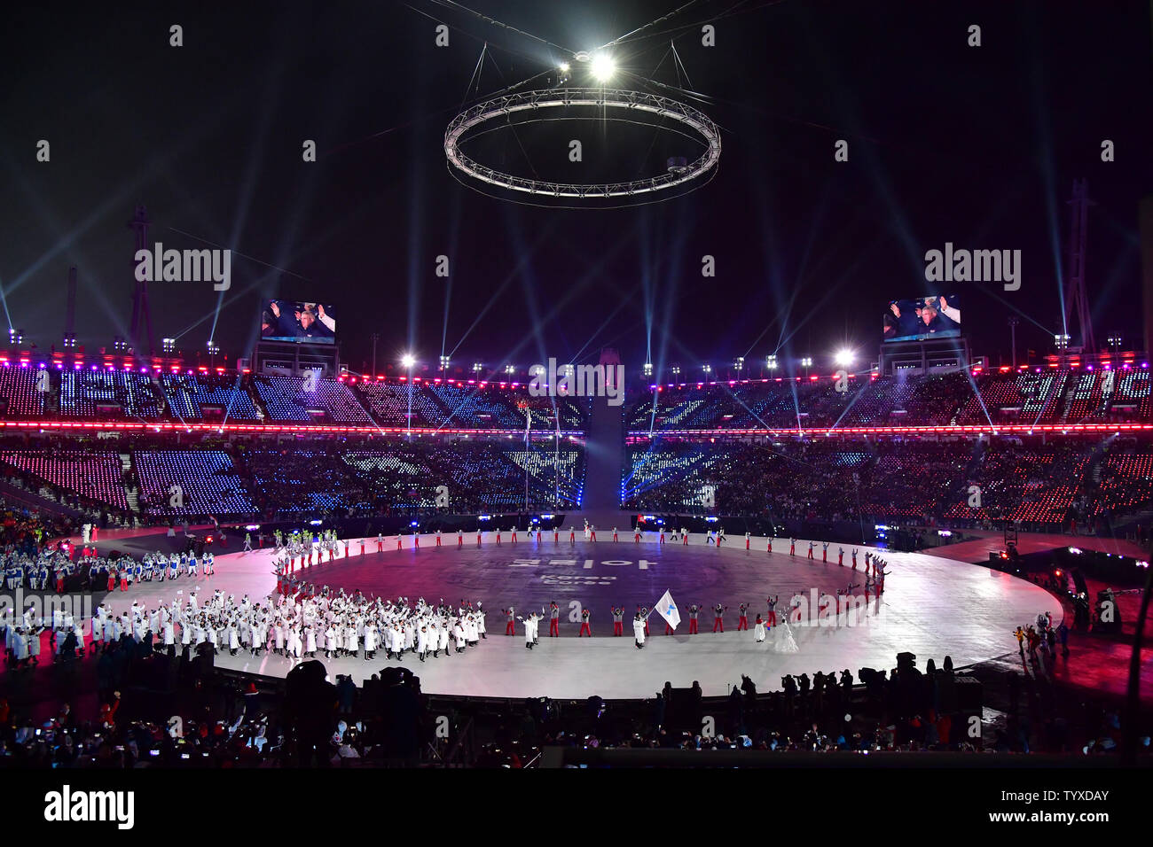 Athletes from North and South Korean marching under a unified flag ...