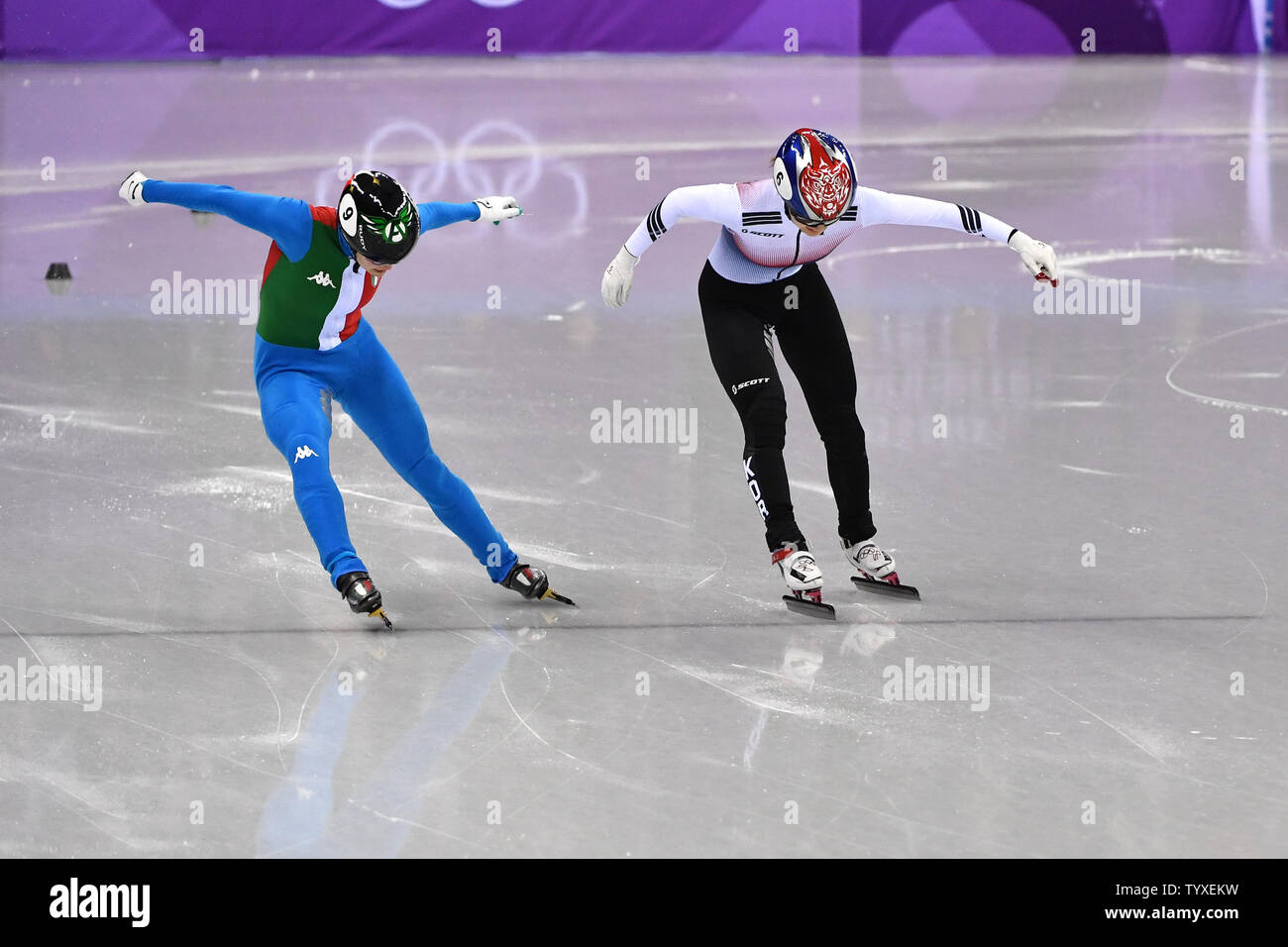 Arianna Fontana of Italy and Minjeong Choi of Korea cross the line in a  photo finish in the finals of the Ladies' 500m Short Track Speed Skating  event during the Pyeongchang 2018
