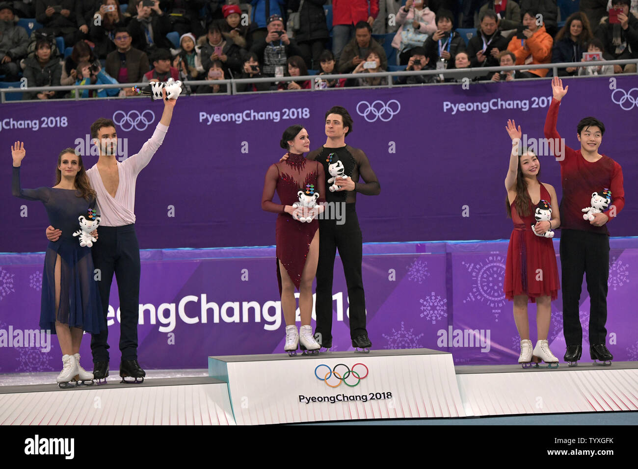 Medal winners in Ice Dancing Free Dance celebrate their victory during
