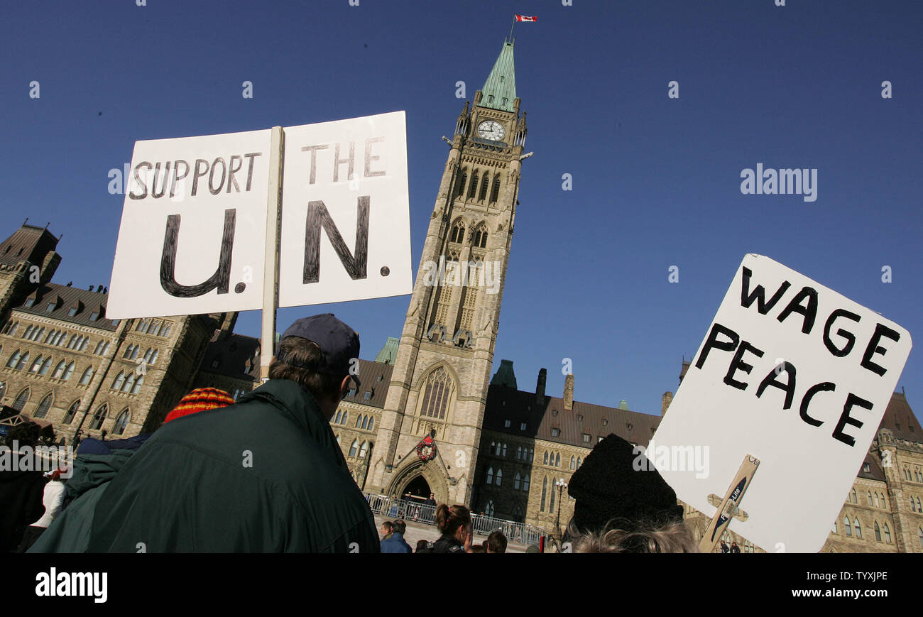 Protesters demonstrate peacefully on Parliament Hill in Ottawa as U.S. President George W. Bush meets Canadian Prime Minister Paul Martin inside, on November 30, 2004.  This is President Bush's first official visit to Canada.  (UPI Photo/ Grace Chiu) Stock Photo
