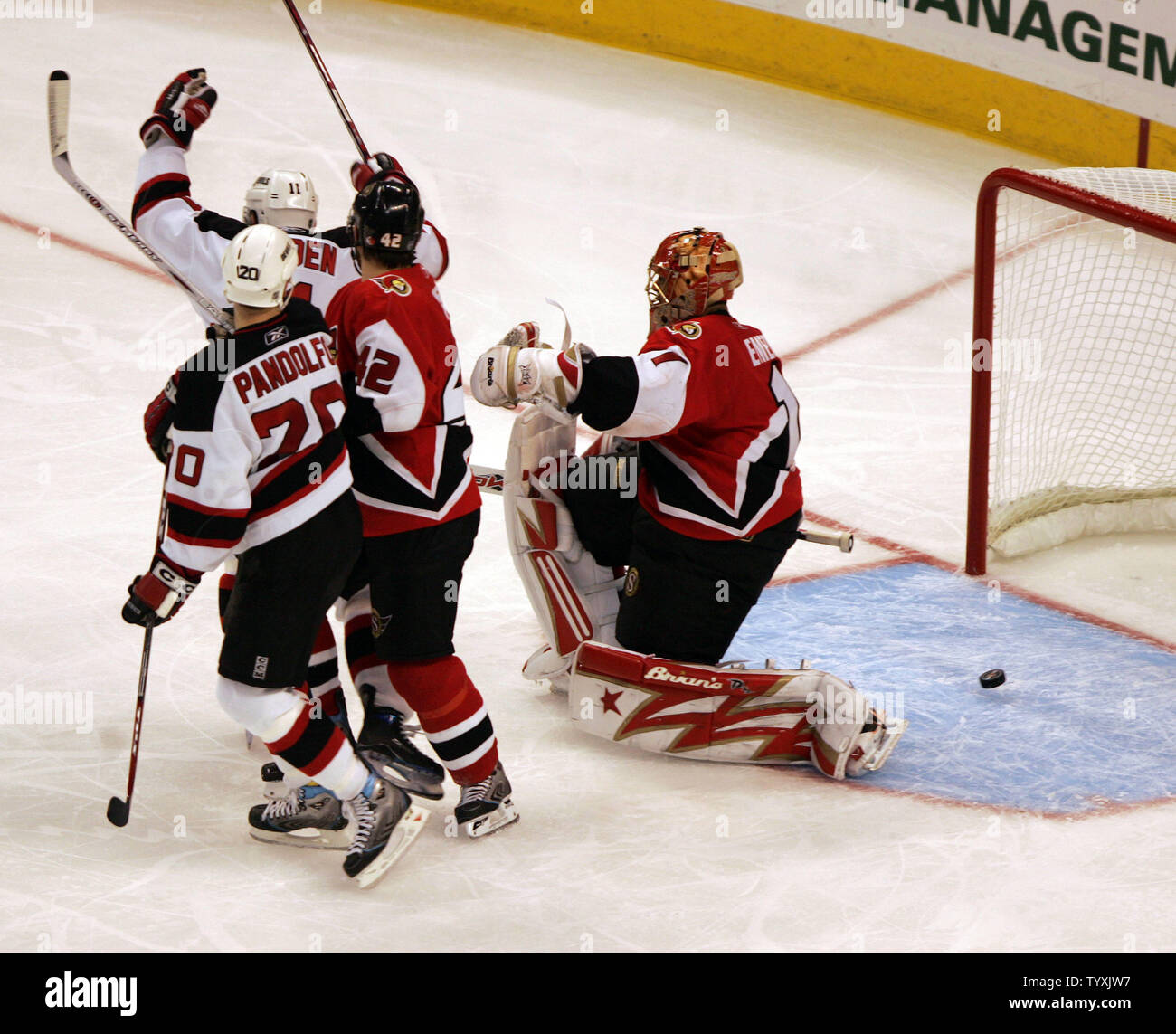 New Jersey Devils Zach Parise, Jamie Langenbrunner and Paul Martin  celebrate a first period goal scored by Parise against the Carolina  Hurricanes of the Eastern Conference Quarterfinals at the Prudential Center  in
