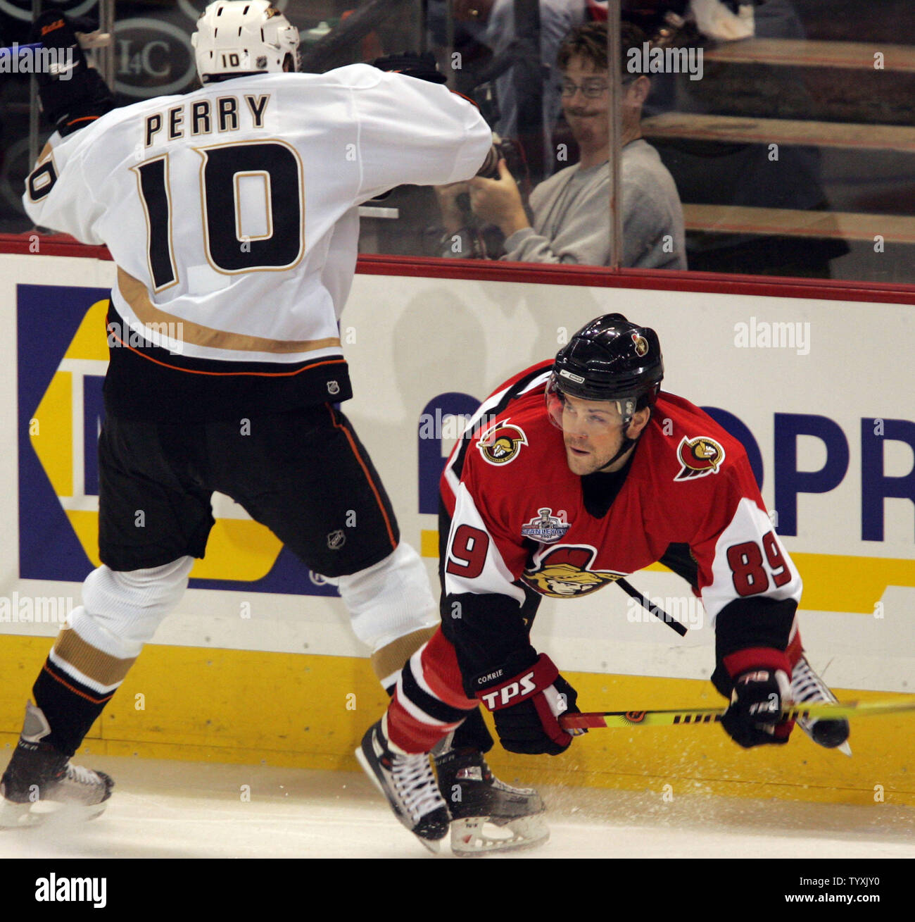 Ottawa Senators Right Wing Mike Comrie 89 Evades A Check From Anaheim Ducks Right Wing Corey Perry During The First Period Of Game Three Of The Stanley Cup Finals At Scotiabank Place