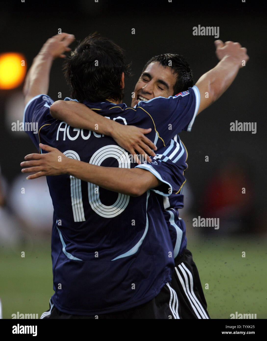 Argentina's Maximiliano Moralez (R) hugs a teammate Sergio Aguero after scoring against Panama during the first half of the FIFA Under-20 World Cup match at Frank Clair Stadium in Ottawa, Canada on July 3, 2007. (UPI Photo/Grace Chiu). Stock Photo