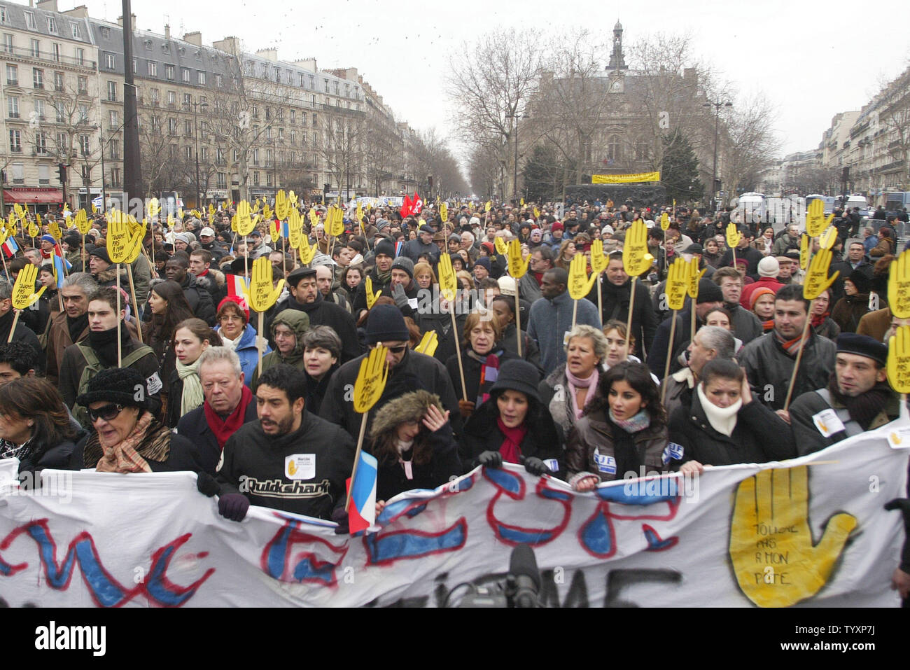 Tens of thousands of people march in homage to Ilan Halimi and against  racism and antisemitism in Paris on February 26, 2006. Halimi, 23, was  kidnaped and tortured to death in a