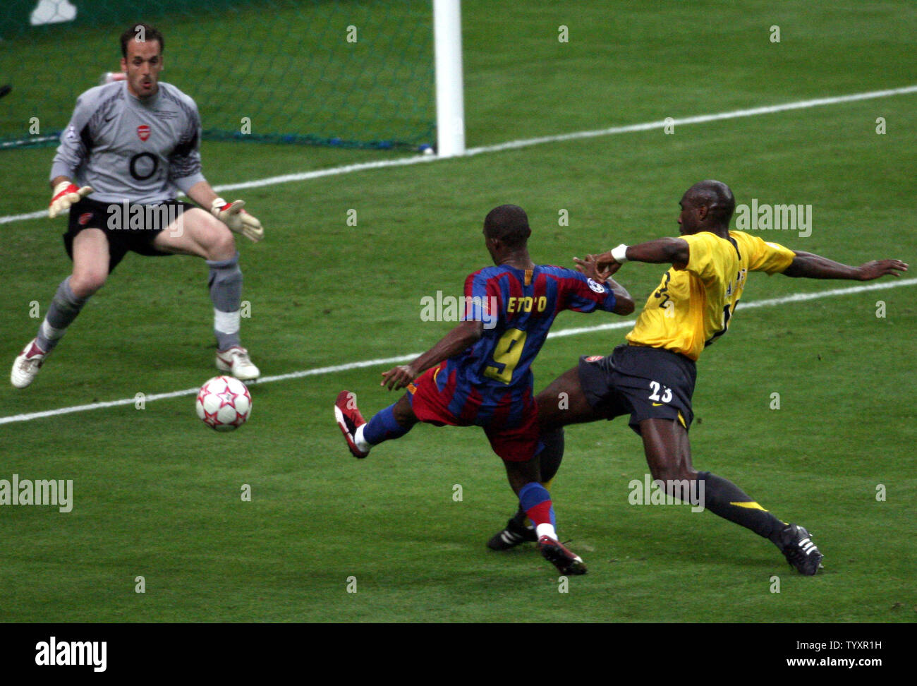FC Barcelona tries to score against Arsenal FC goalkeeper Manuel Almunia as teammate Sol Campbell tries to stop him during their UEFA Champions League soccer final at the Stade de France in Saint Denis, near Paris, May 17, 2006. Barcelona won 2-1. (UPI Photo/Eco Clement) Stock Photo