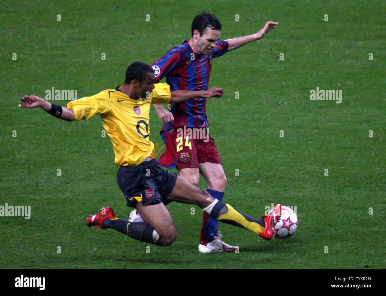 FC Barcelona Andres Iniesta (R) and Arsenal FC Ashley Cole fight for the ball during their UEFA Champions League soccer final at the Stade de France in Saint Denis, near Paris, May 17, 2006. Barcelona won 2-1. (UPI Photo/Eco Clement) Stock Photo