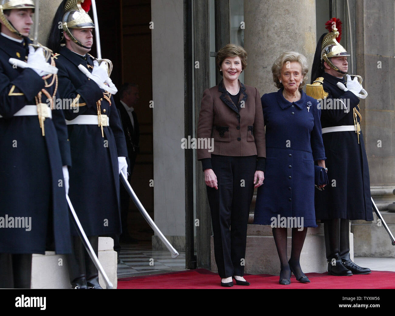 Bernadette Chirac, the wife of the French president (R) and U.S. First Lady Laura Bush review the honor guard upon her arrival at the Elysee Palace in Paris, January 17, 2007 to attend a committee on lost and exploited children.  (UPI Photo/Eco Clement) Stock Photo