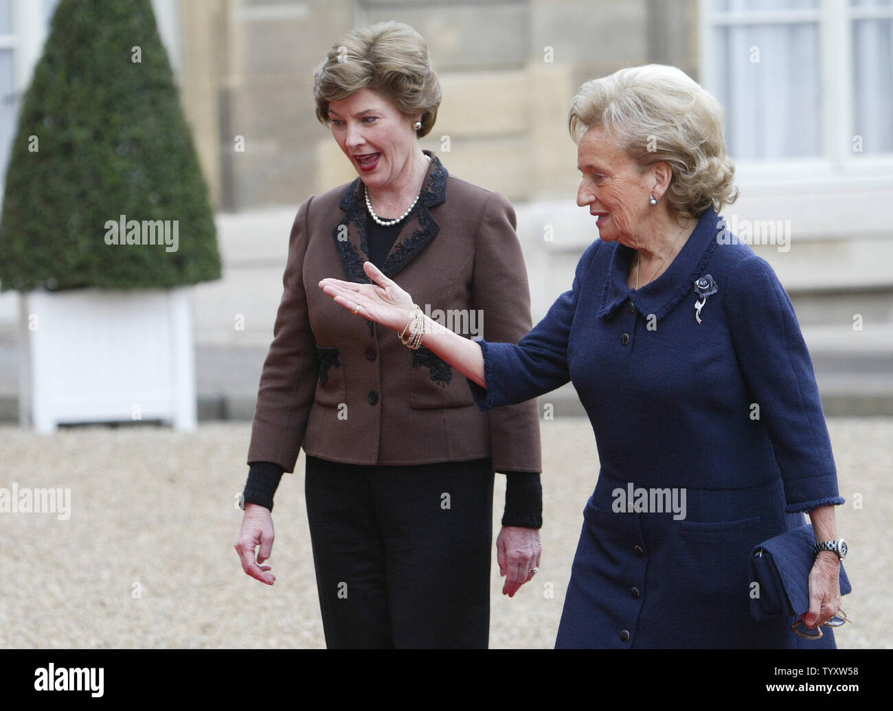 Bernadette Chirac, the wife of the French president, greets U.S. First Lady Laura Bush (L) upon her arrival at the Elysee Palace in Paris, January 17, 2007 to attend a committee on lost and exploited children.  (UPI Photo/Eco Clement) Stock Photo