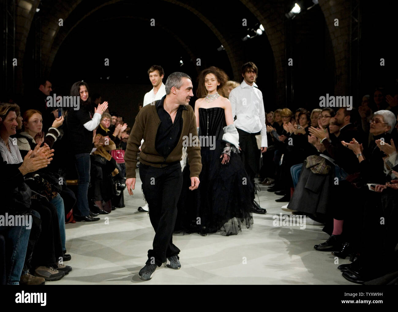 Fashion designer Marc le Bihan acknowledges applause following the 