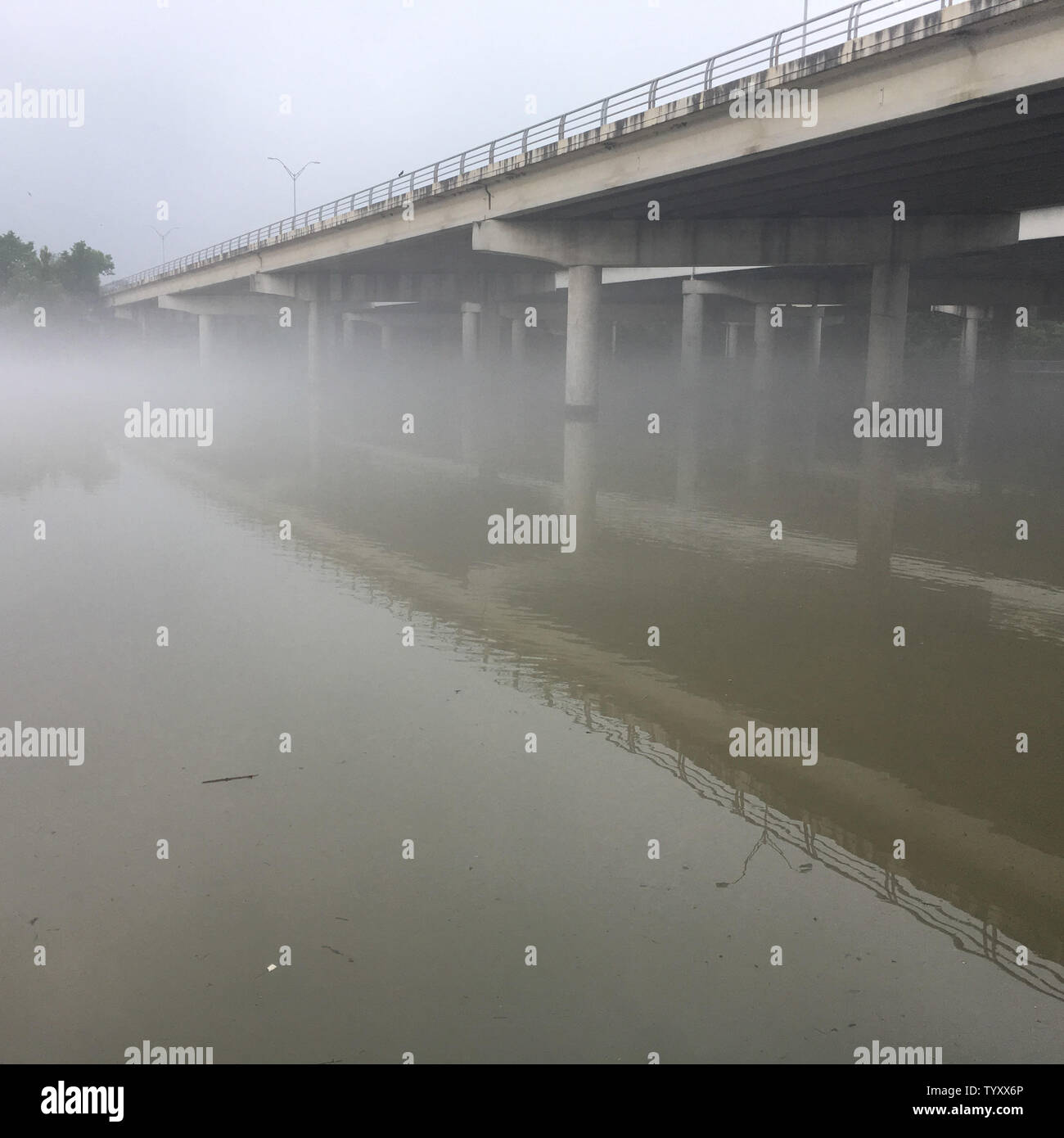 I-35 bridge over Lady Bird Lake on a foggy day in Austin, Texas Stock Photo