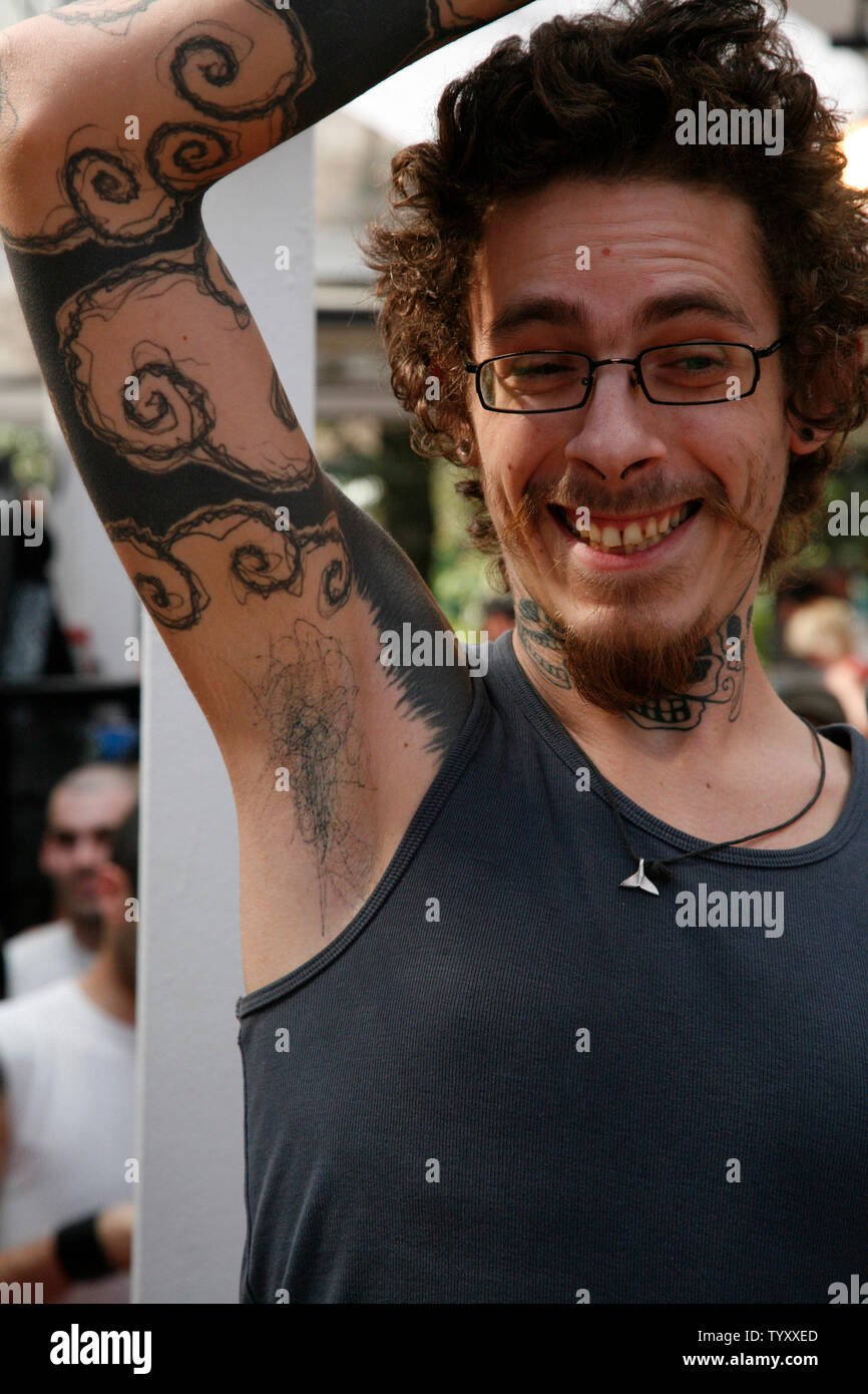 A festival attendee displays his tattoo during the Tattoo Art Festival at  Parc Floral in Paris on April 28, 2007. This attendee was the winner of the  