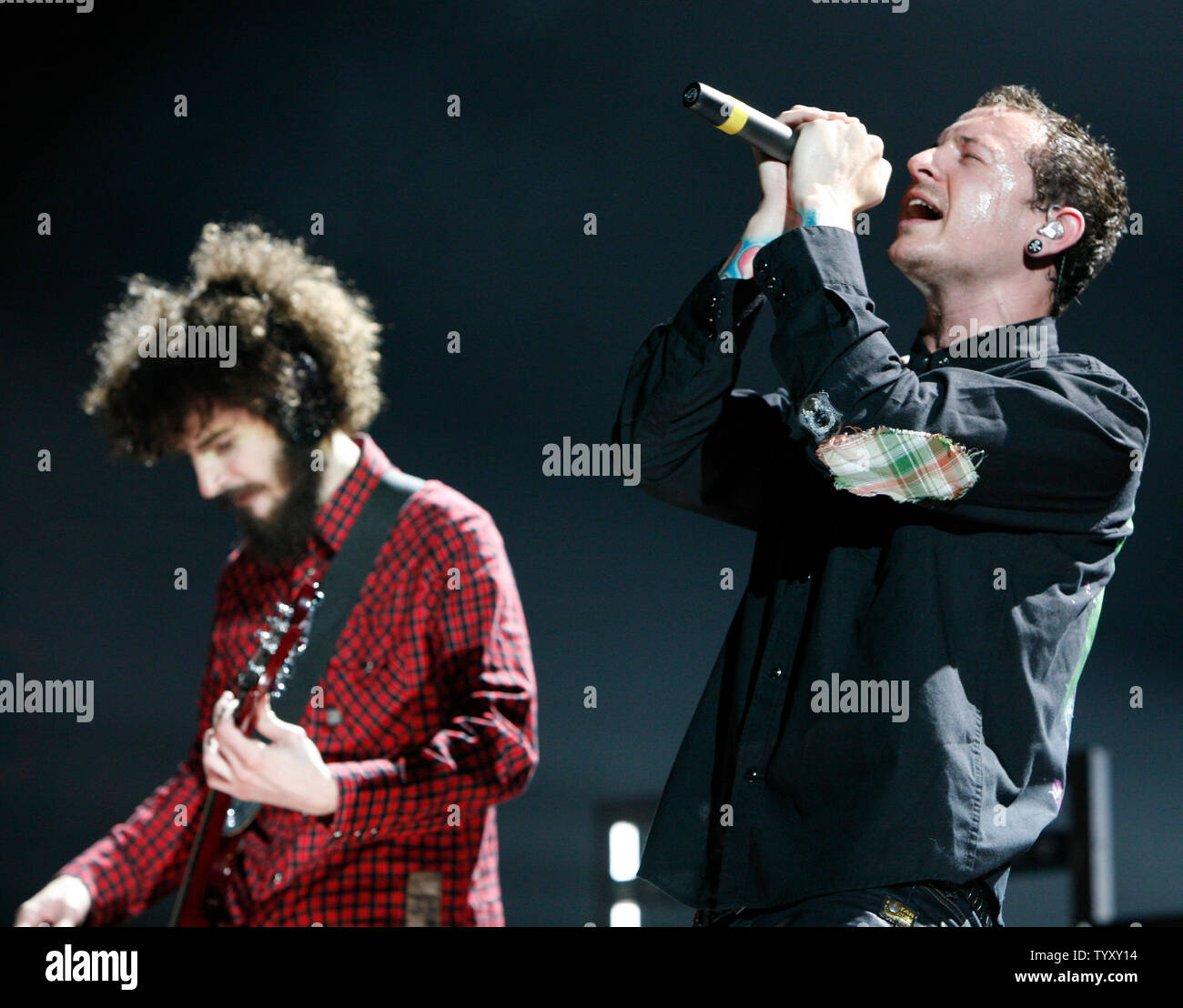 Singer Chester Bennington (R) and guitarist Brad Delson of the band Linkin Park perform in concert at Bercy in Paris on May 30, 2007.   (UPI Photo/David Silpa) Stock Photo