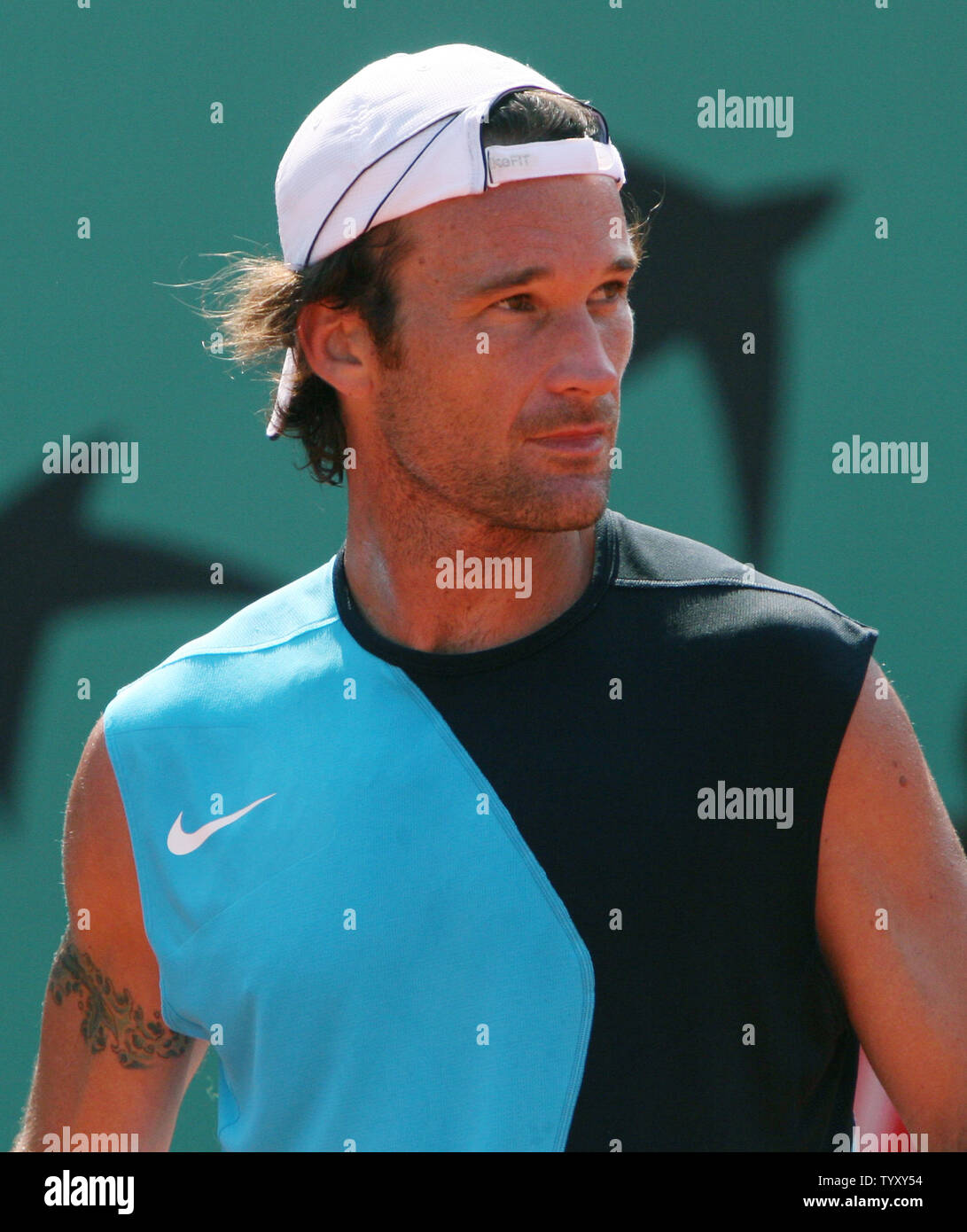 Spaniard Carlos Moya focuses during a break in his third round match against Argentinian Juan Pablo Brzezicki at the French Open at Roland Garros in Paris on June 2, 2007.  Moya, the number 23 seed, defeated the unseeded Brzezicki in straight sets 6-1, 6-3, 7-5.   (UPI Photo/ David Silpa) Stock Photo