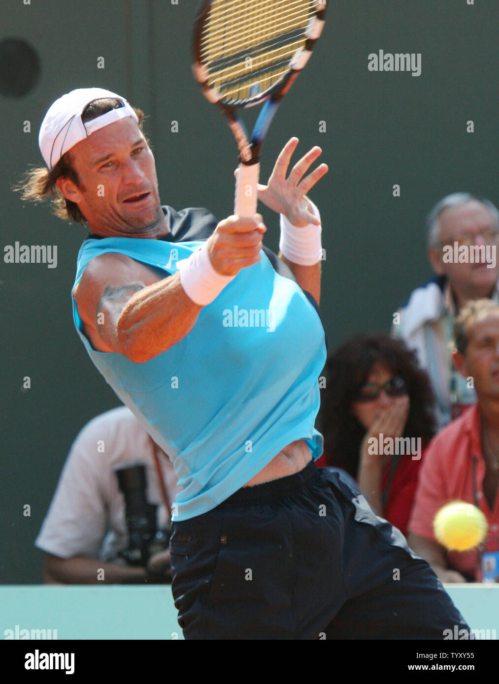 Spaniard Carlos Moya hits a forehand during his third round match against Argentinian Juan Pablo Brzezicki at the French Open at Roland Garros in Paris on June 2, 2007.  Moya, the number 23 seed, defeated the unseeded Brzezicki in straight sets 6-1, 6-3, 7-5.   (UPI Photo/ David Silpa) Stock Photo