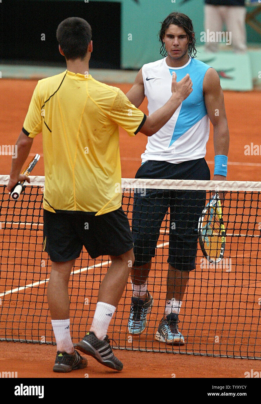 Rafael Nadal (R) of Spain shakes hands with Serb Novak Djokovic at the end  of their semi-final match at the French Open in Roland Garros, near Paris,  June 8, 2007. Nadal won