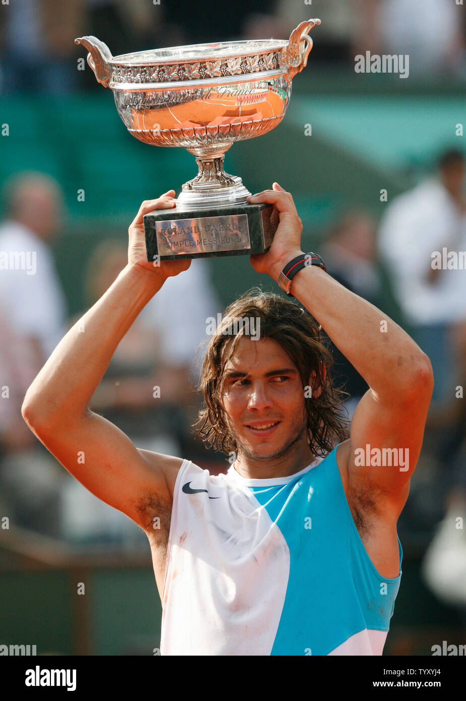 Spaniard Rafael Nadal holds up the championship trophy after winning his  final round match against Roger Federer of Switzerland at the French Open  at Roland Garros in Paris on June 10, 2007.