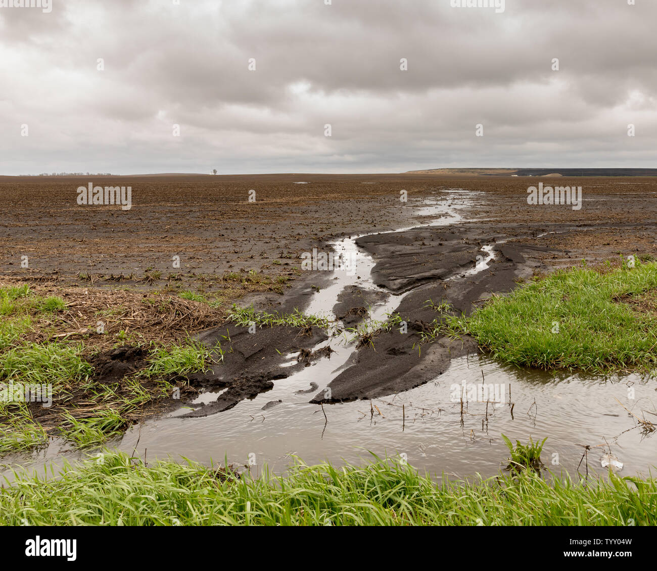 Heavy rains and storms in the Midwest have caused flooding of farm fields and water runoff has lead to soil erosion and drainage issues Stock Photo