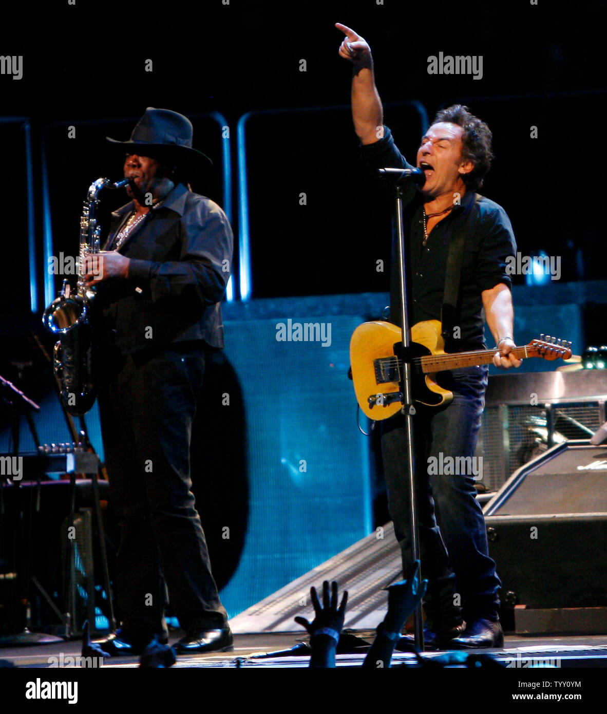 Bruce Springsteen (R) and saxophone player Clarence Clemons perform in
