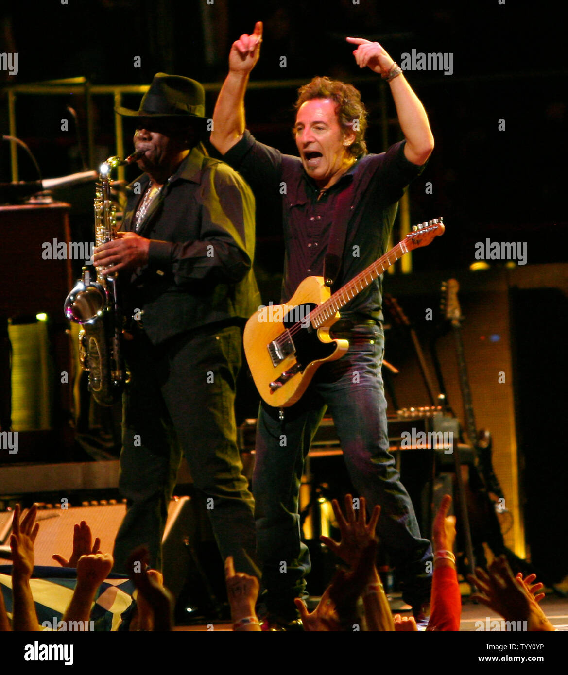 Bruce Springsteen (R) and saxophone player Clarence Clemons perform in