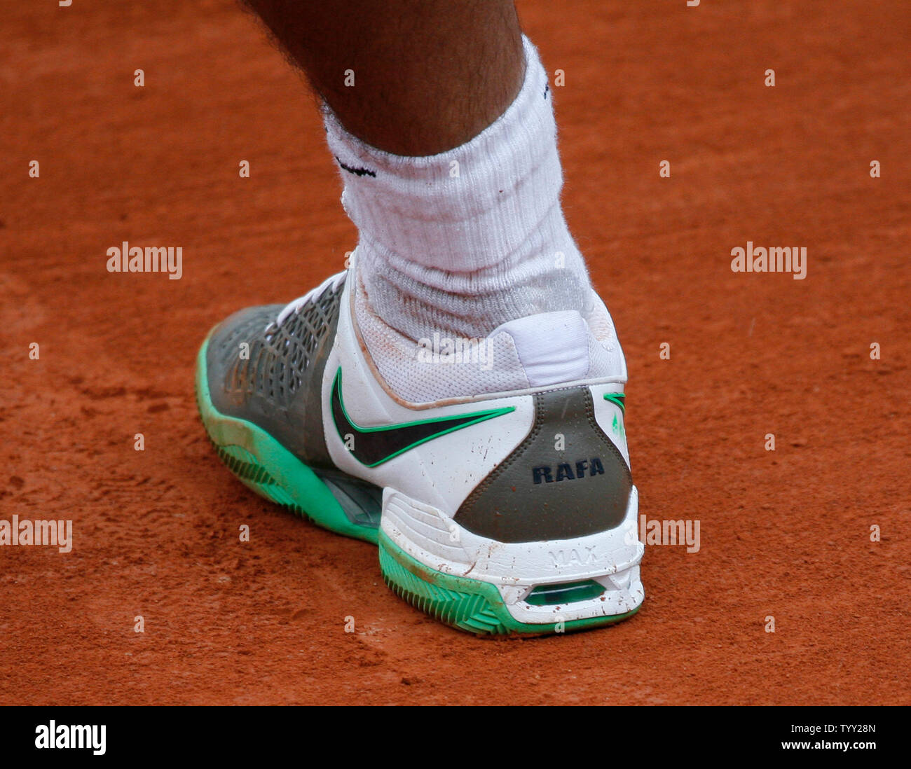 Rafael Nadal of Spain sports shoes with his nickname "Rafa" on them during  his quarterfinal match with Nicolas Almagro of Spain at the French Tennis  Open in Paris on June 3, 2008.