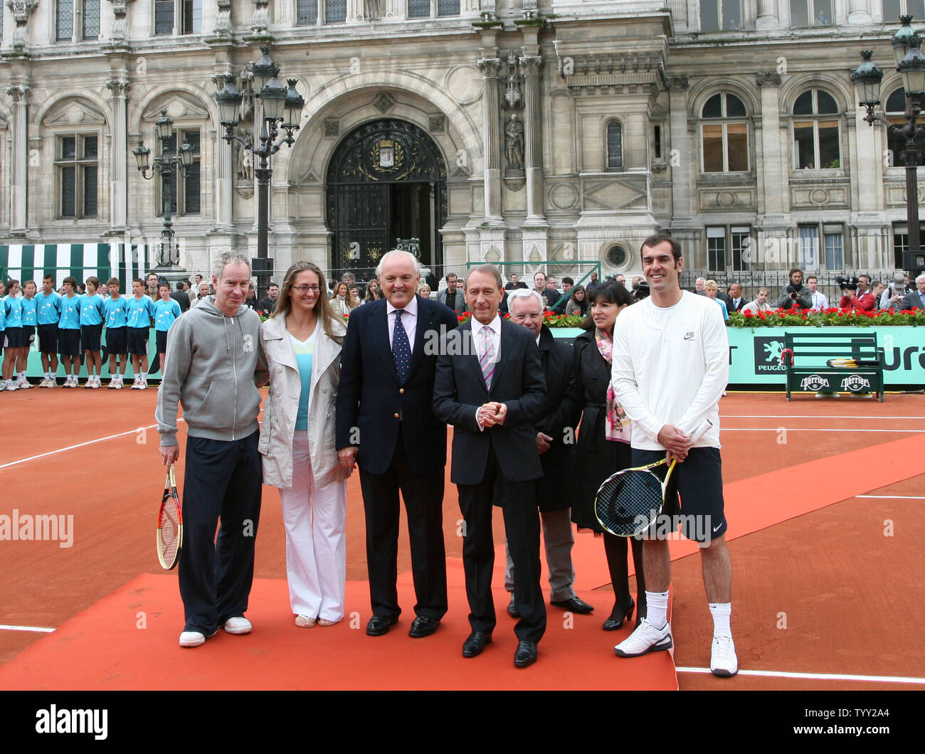 (From L to R) Tennis greats John McEnroe and Mary Pierce, President of the French Tennis Federation Christian Bimes, Mayor of Paris Bertrand Delanoe, unidentified and tennis great Cedric Pioline arrive on a clay court set up in front of the Hotel de Ville (city hall) during the launch of the exhibition 'Roland Garros in the City' in Paris on June 4, 2008.  The event coincides with the French Open tennis tournament taking place this week in Paris.   (UPI Photo/ David Silpa) Stock Photo