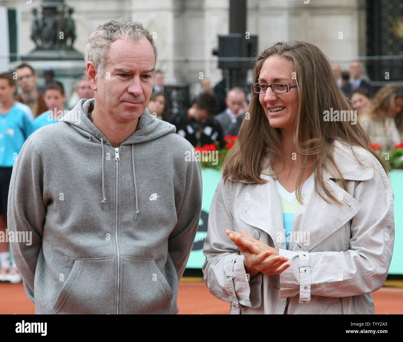 Tennis greats John McEnroe and Mary Pierce arrive on a clay court set up in front of the Hotel de Ville (city hall) during the launch of the exhibition 'Roland Garros in the City' in Paris on June 4, 2008.  The event coincides with the French Open tennis tournament taking place this week in Paris.   (UPI Photo/ David Silpa) Stock Photo