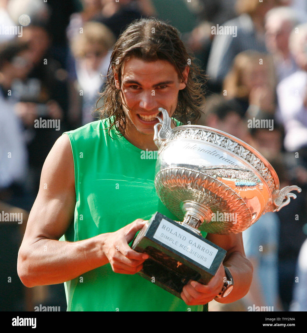 Rafael Nadal of Spain holds the champion's trophy after winning his finals  match with Roger Federer of Switzerland at the French Tennis Open in Paris  on June 8, 2008. The second-seeded Nadal