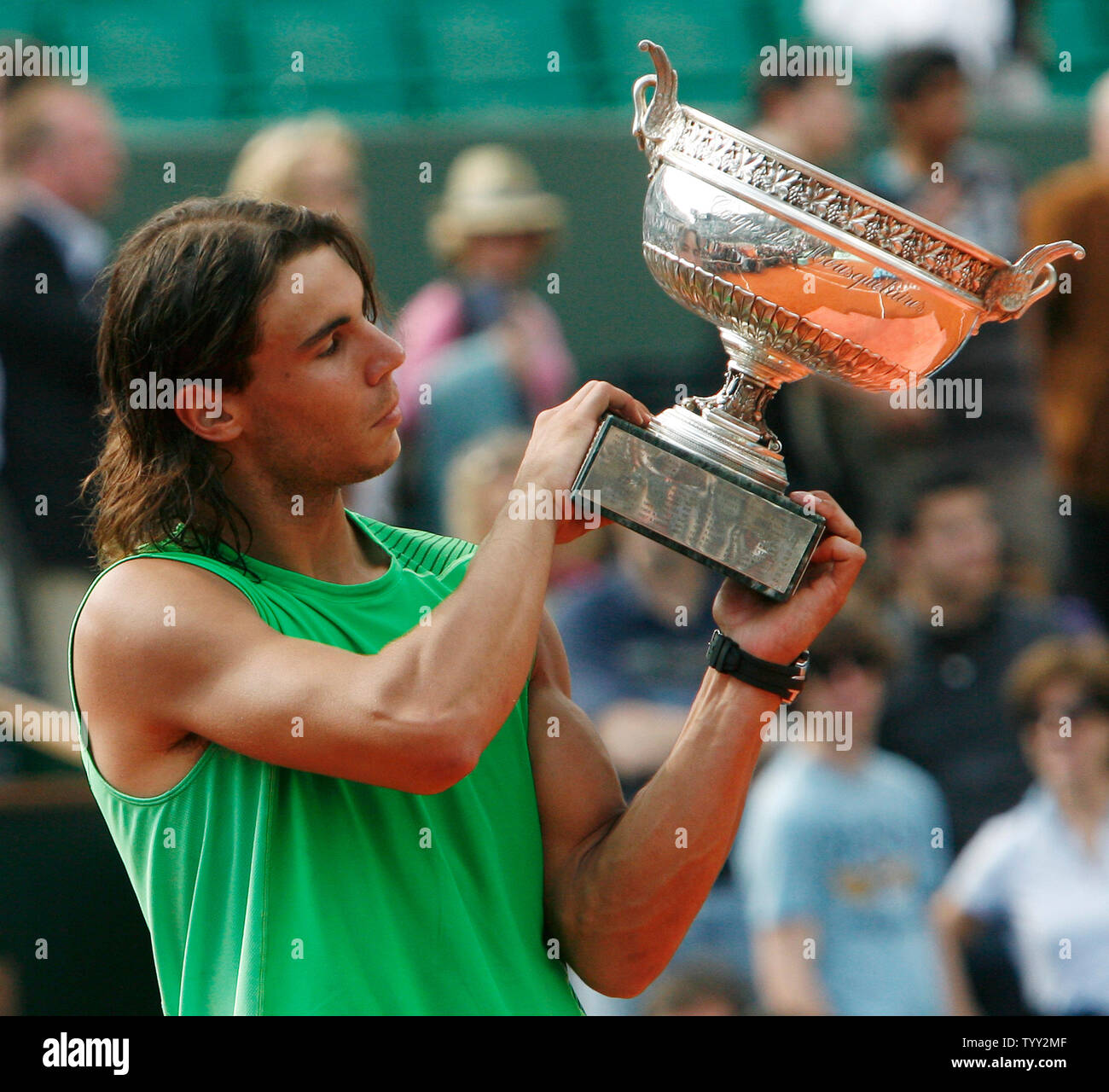 Rafael Nadal of Spain holds the champion's trophy after winning his finals  match with Roger Federer of Switzerland at the French Tennis Open in Paris  on June 8, 2008. The second-seeded Nadal